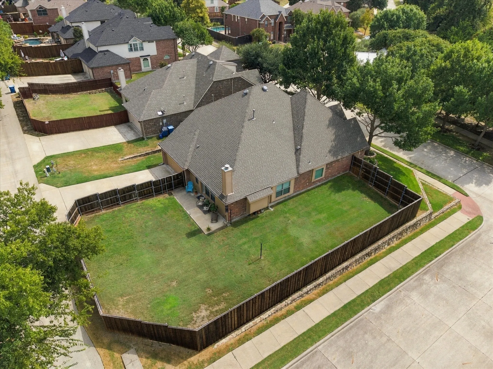 Large fenced back yard provides ample room for pool and more!
