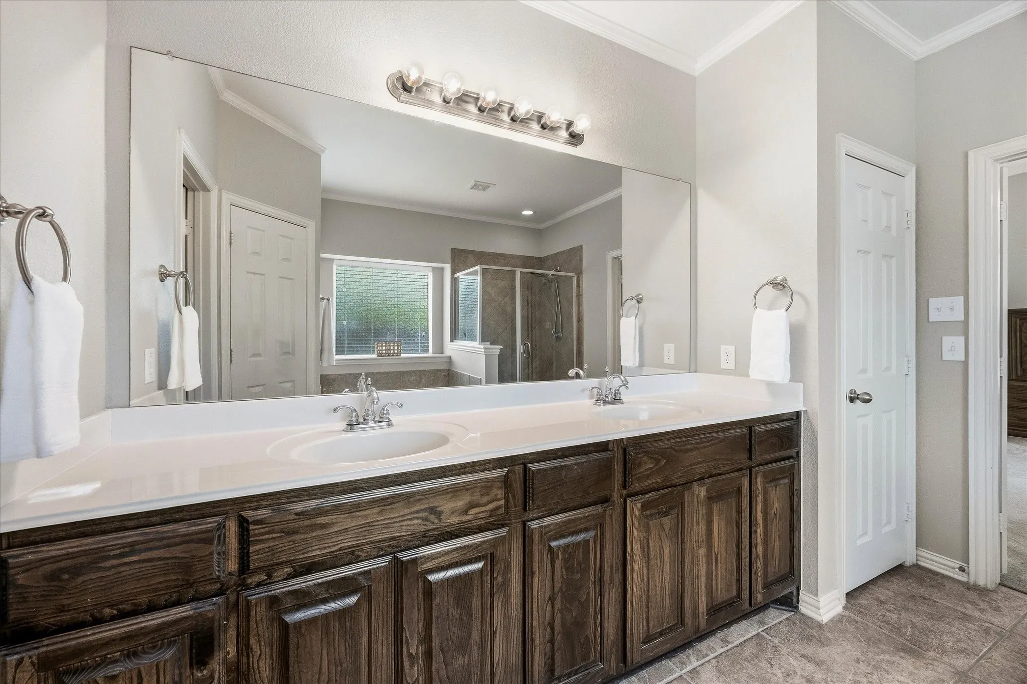 His and her vanities include ample cabinet space