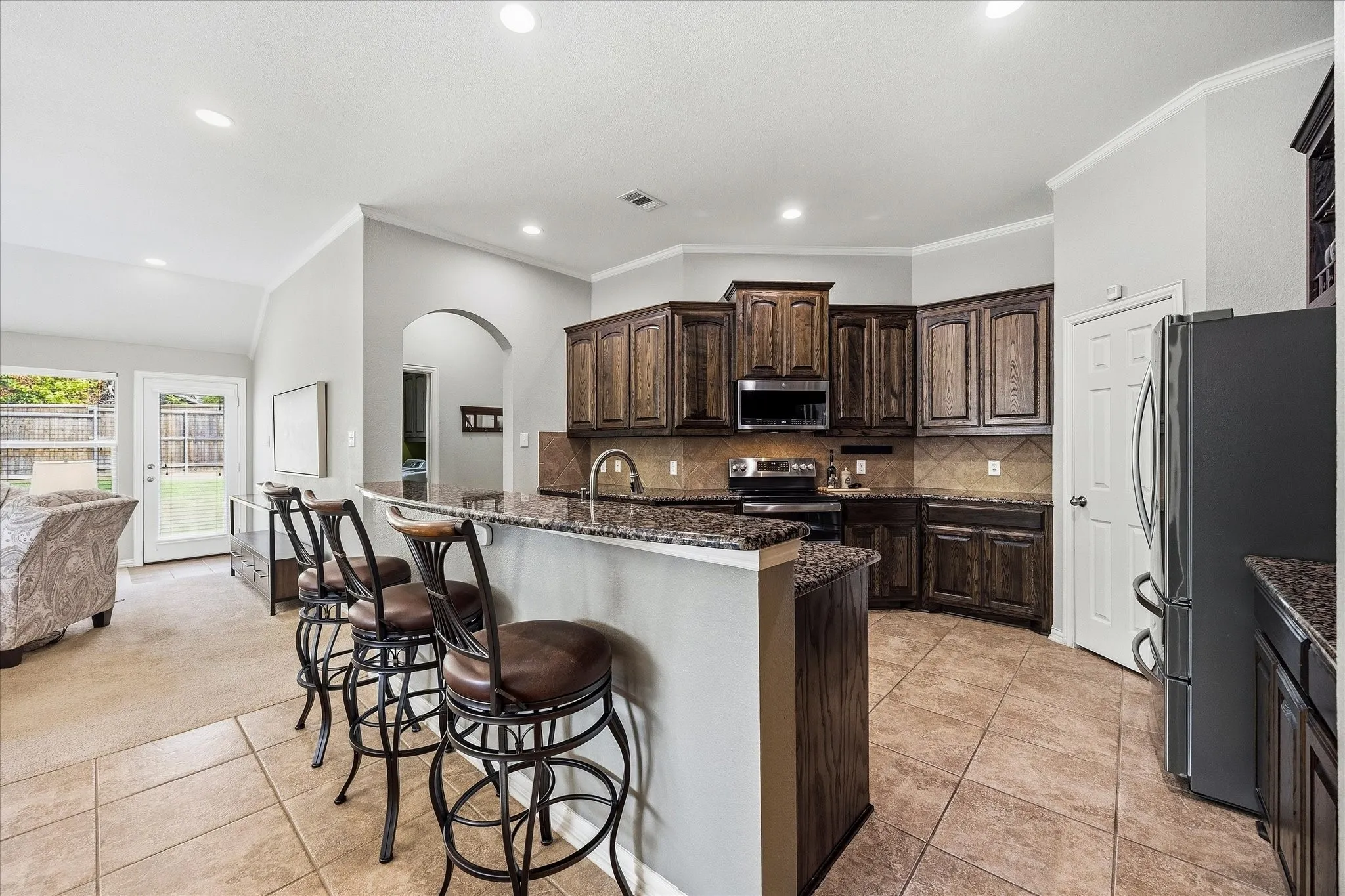 Breakfast bar overlooks gormet kitchen!