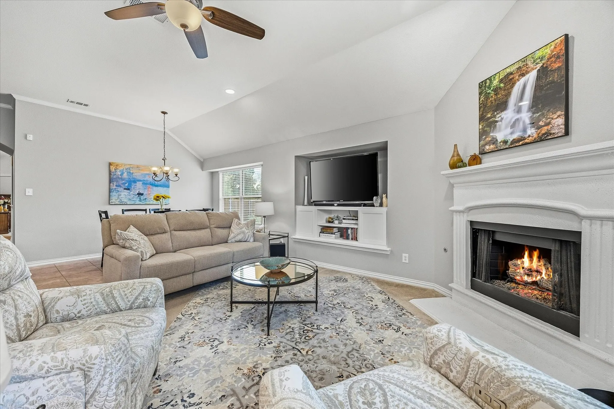 Lovely family room includes beautiful fireplace