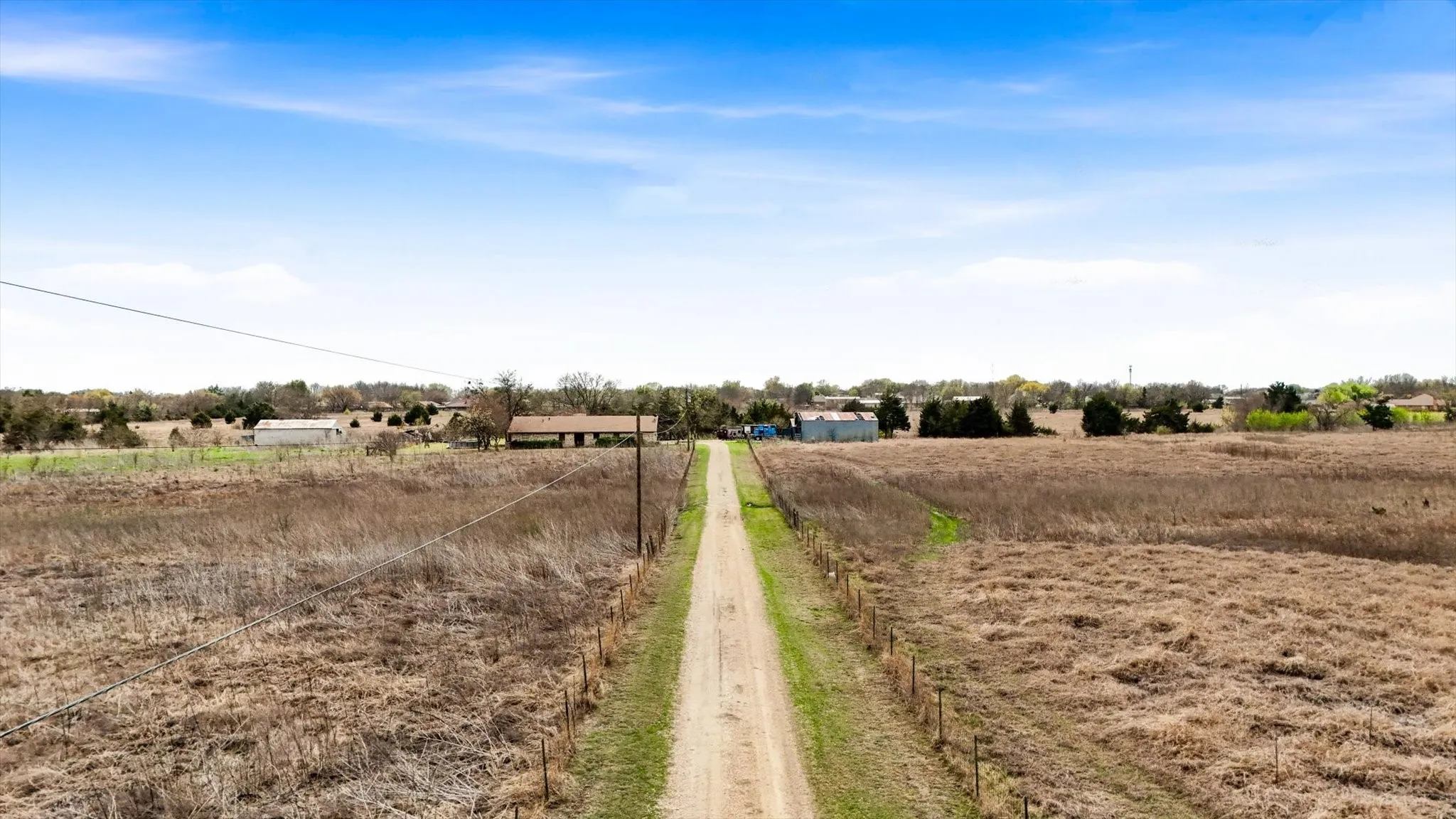 View of dirt / gravel road featuring a rural view