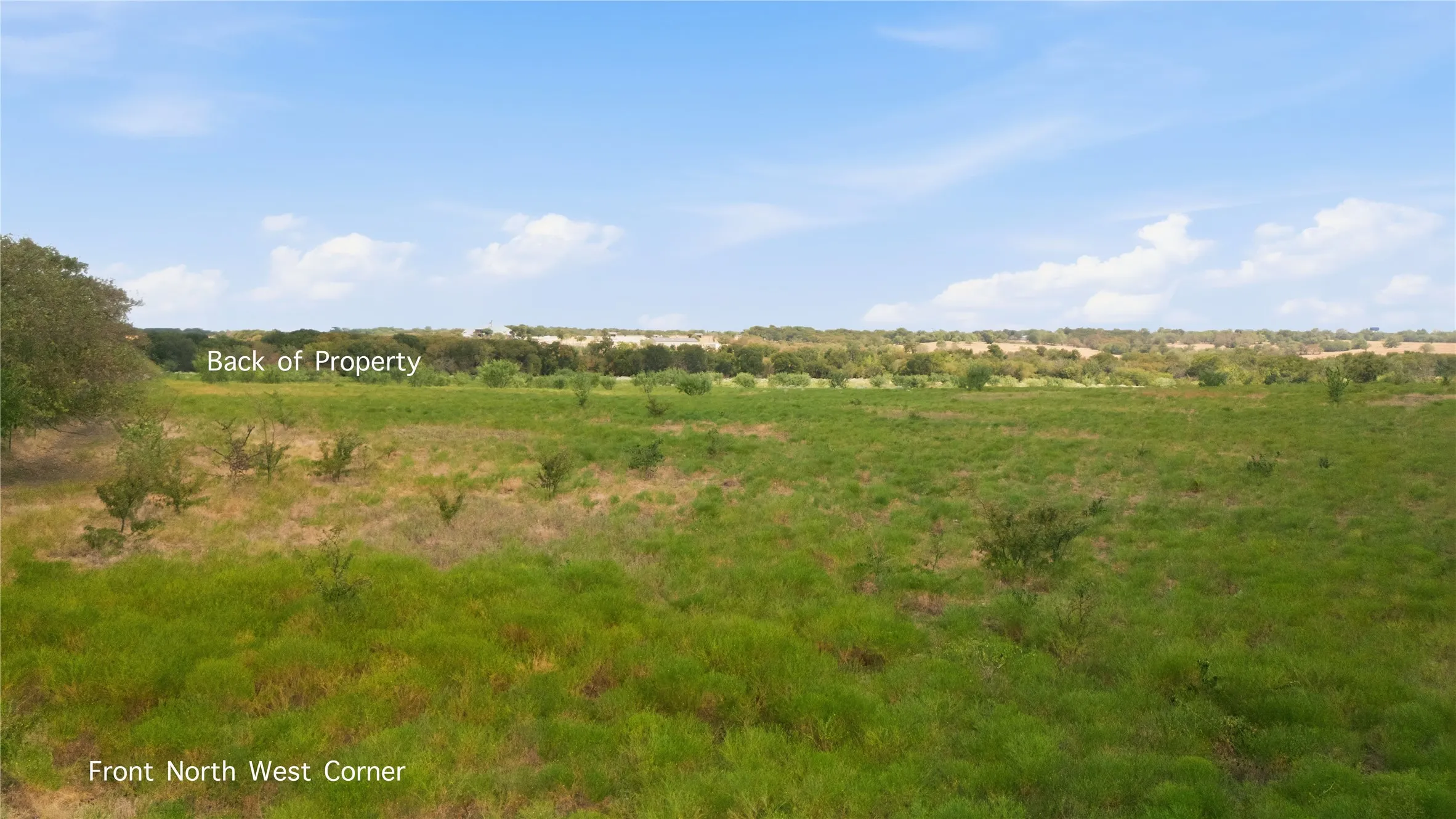Expansive undeveloped land featuring varied terrain and natural vegetation