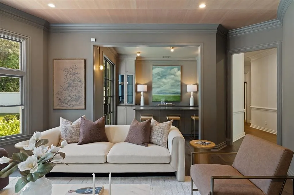 Built-in wet bar with integrated cabinetry and track lighting