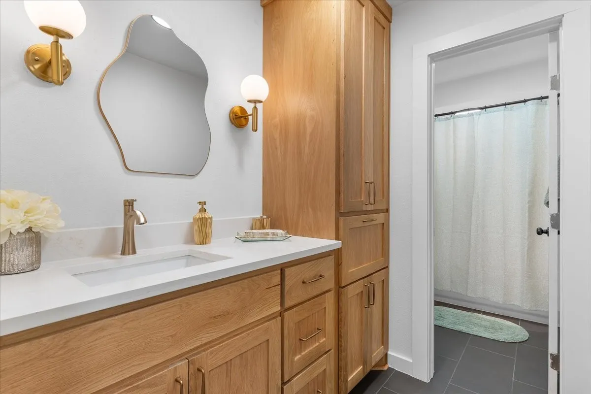 Vanity with an integrated rectangular sink and a light-toned countertop