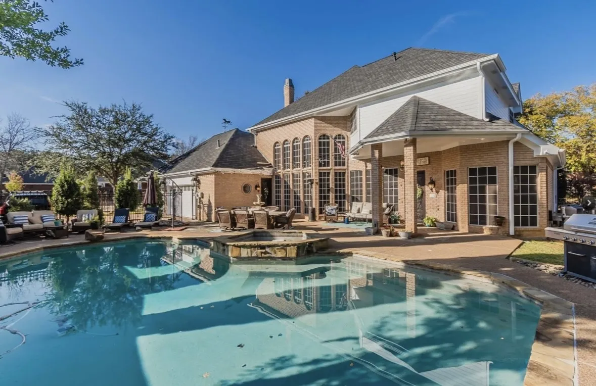 View of pool featuring an in ground hot tub, grilling area, and a patio area