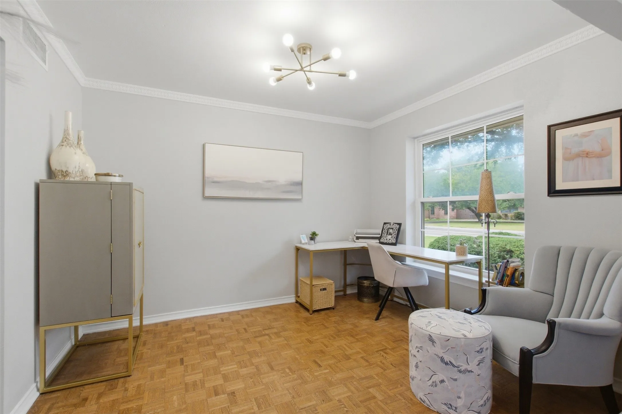 Crown molding, contemporary ceiling light fixture, large window, wood-finish flooring