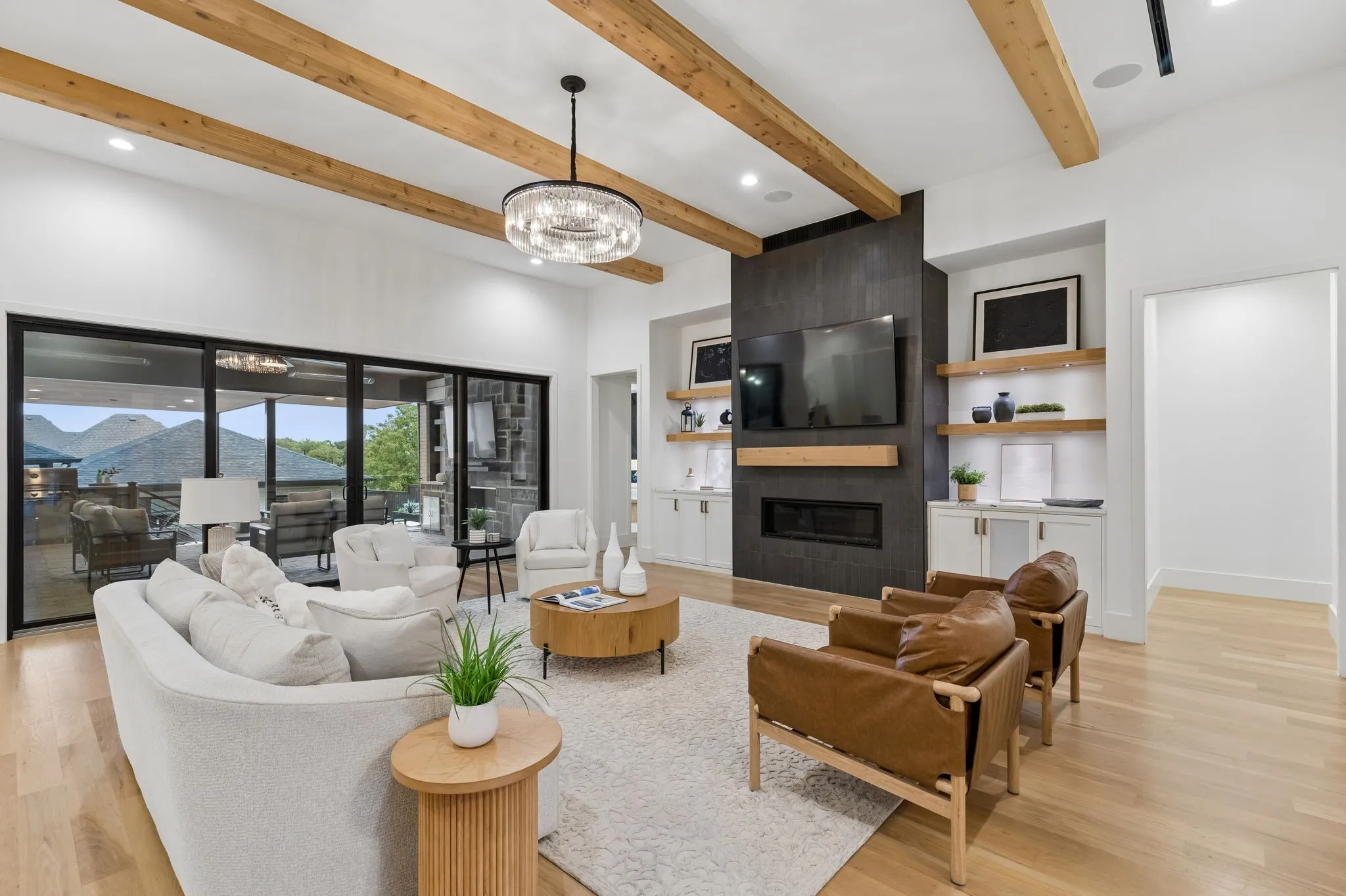 Large living area with custom wood beams.