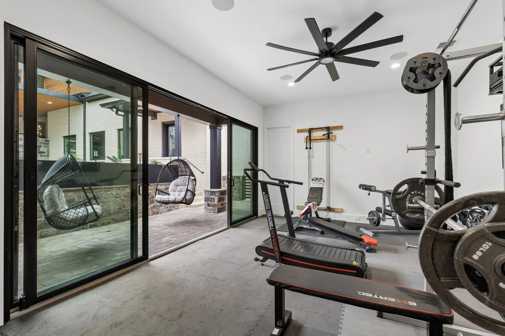 Guest, In-law for multigenerational living or pool house with kitchen and half bath. Currently used as a gym and home business.