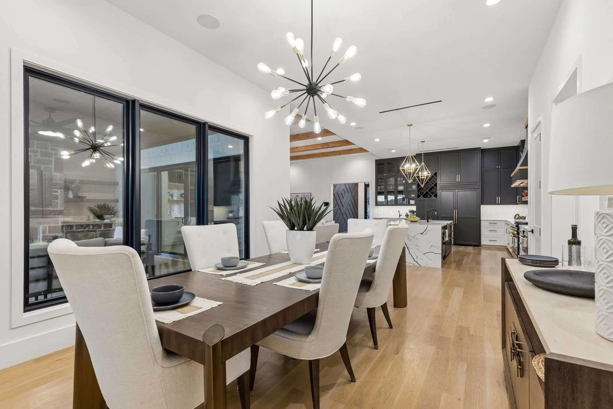 Large dining area with designer lighting.