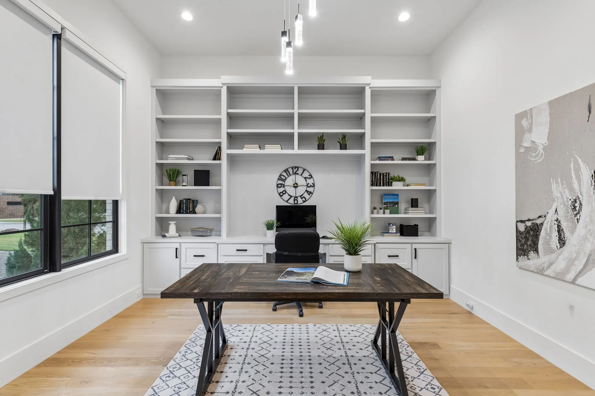 Large study with custom cabinetry.