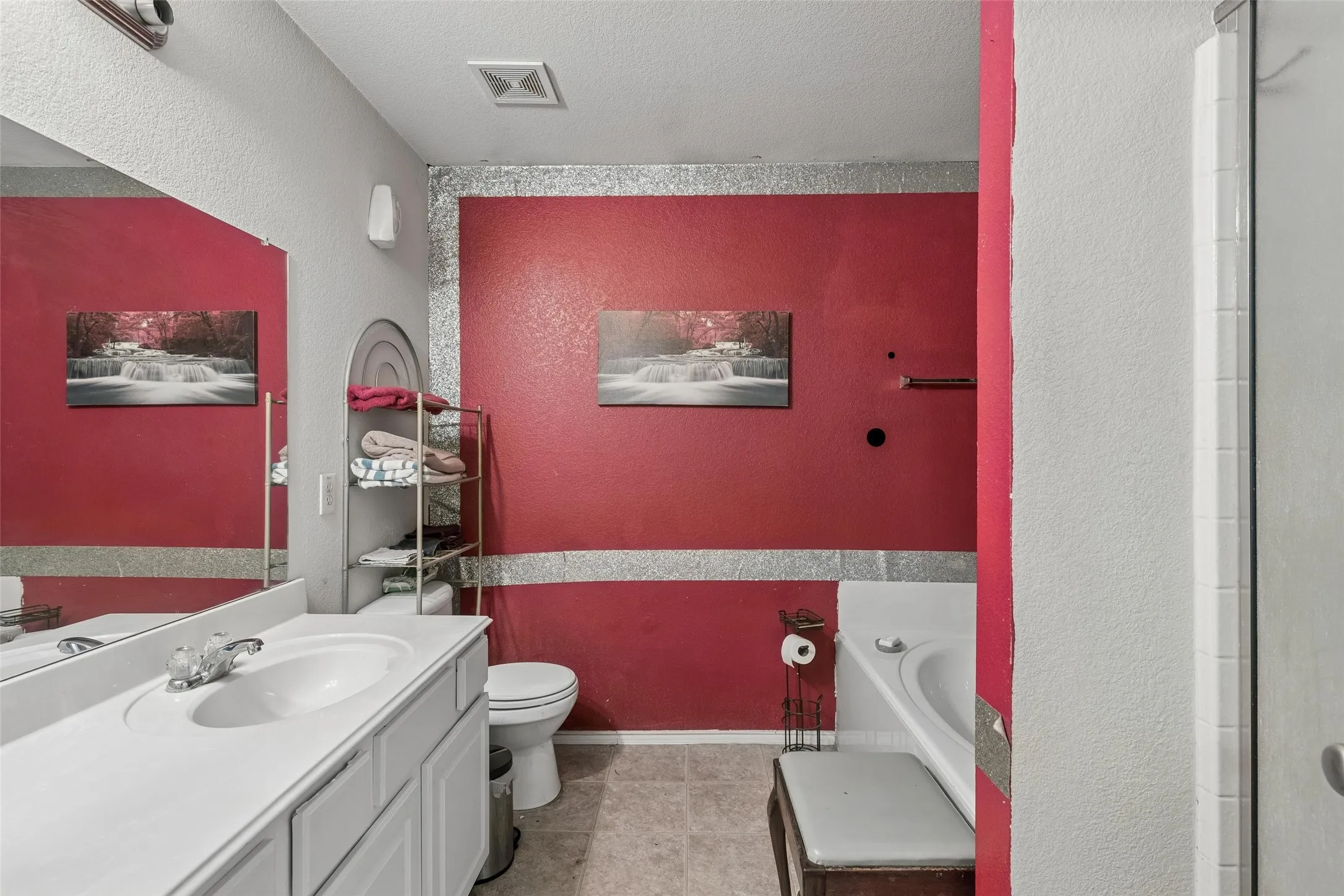 Vanity with integrated sink, chrome-finish faucet, and expansive mirror