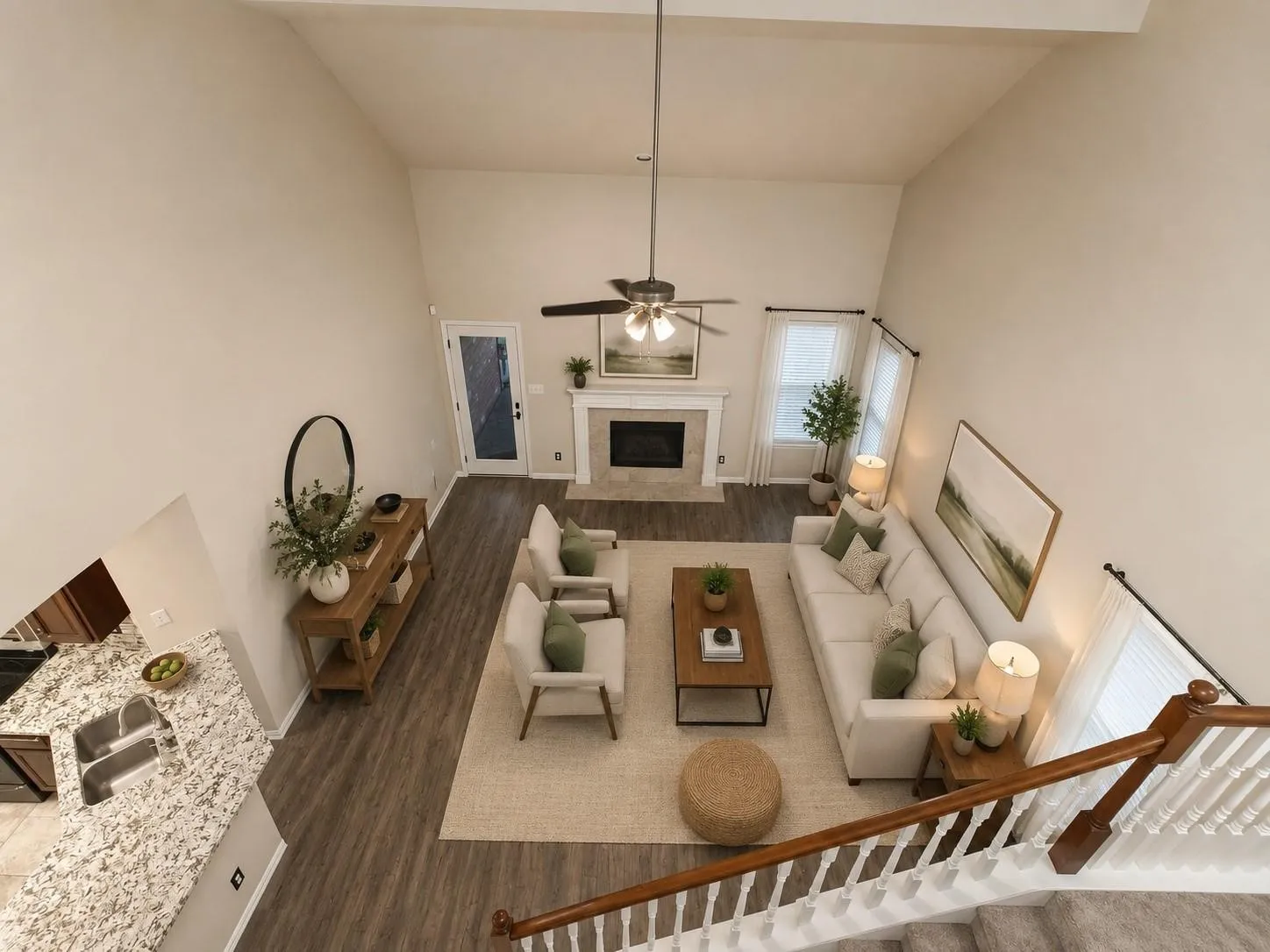Vaulted ceilings highlight the spacious living area with wood-finish flooring