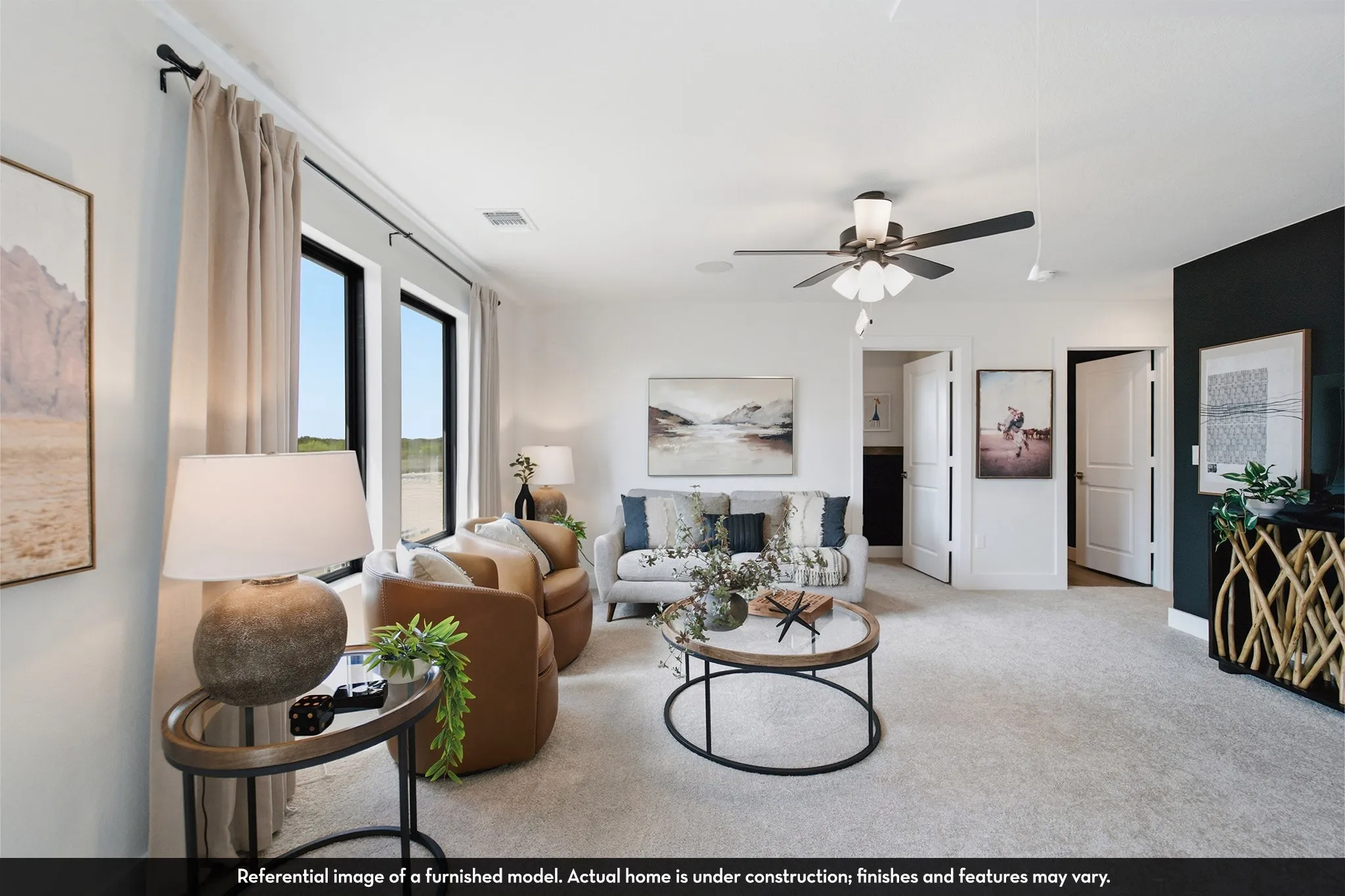 Wall-to-wall carpeting with multiple windows, a ceiling fan, and white paneled doors