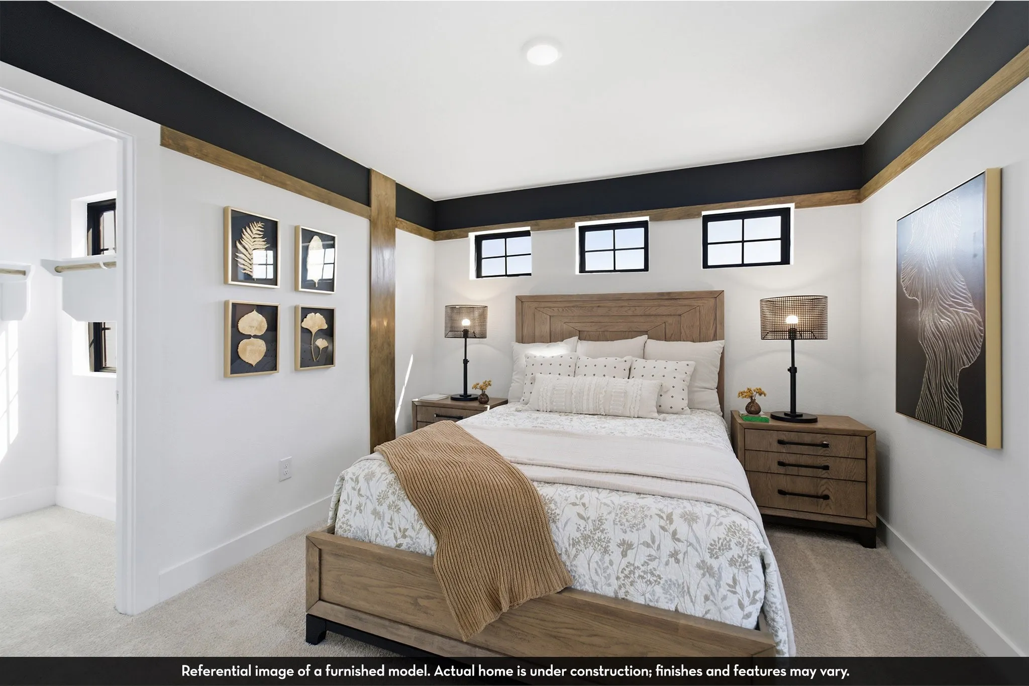 Recessed lighting, light-toned carpeting, white walls, black trim, and wood-finish accent beams
