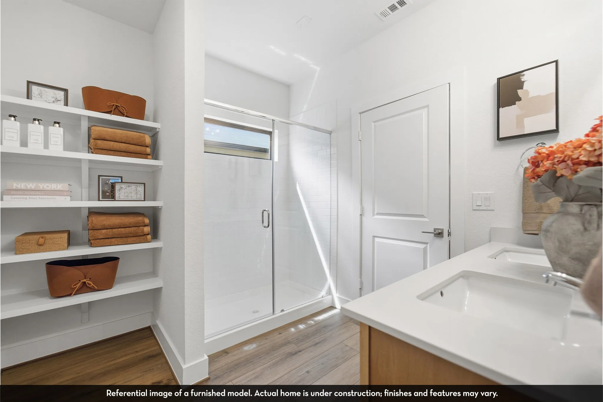 Dual vanity with undermount sinks and light-toned countertops
