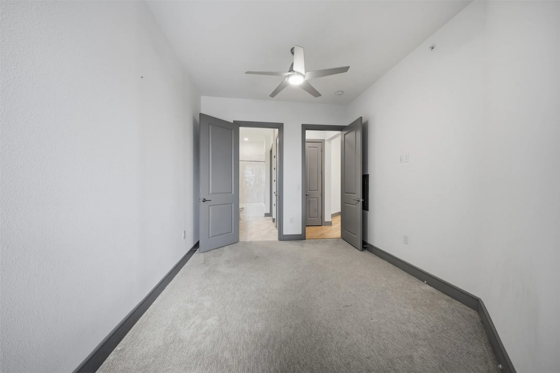 Carpeted room with recessed lighting and a ceiling fan