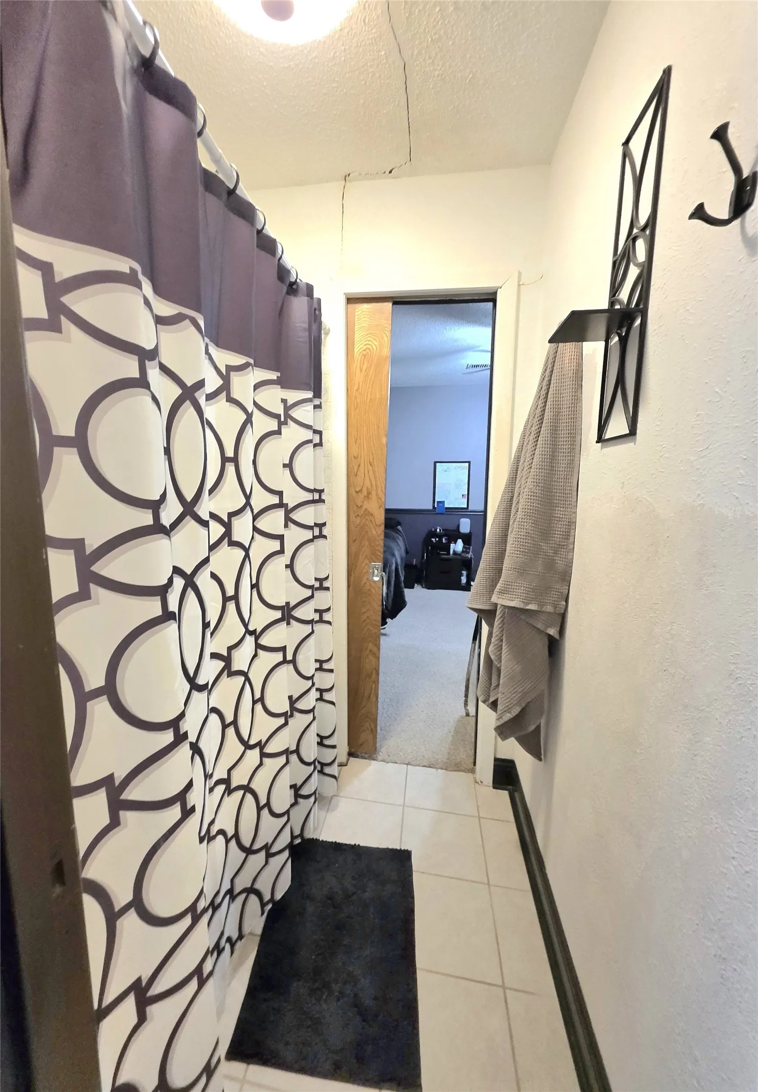 Secondary Bath tub and shower combination area.