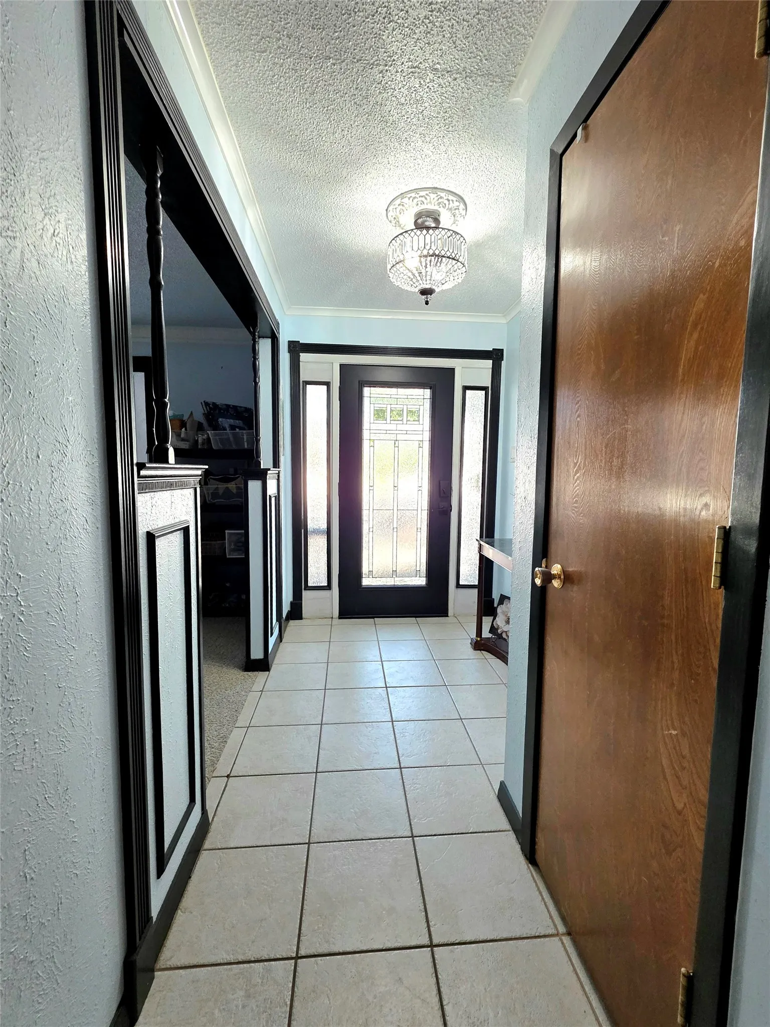 View of Entry hall and gorgeous glass front door