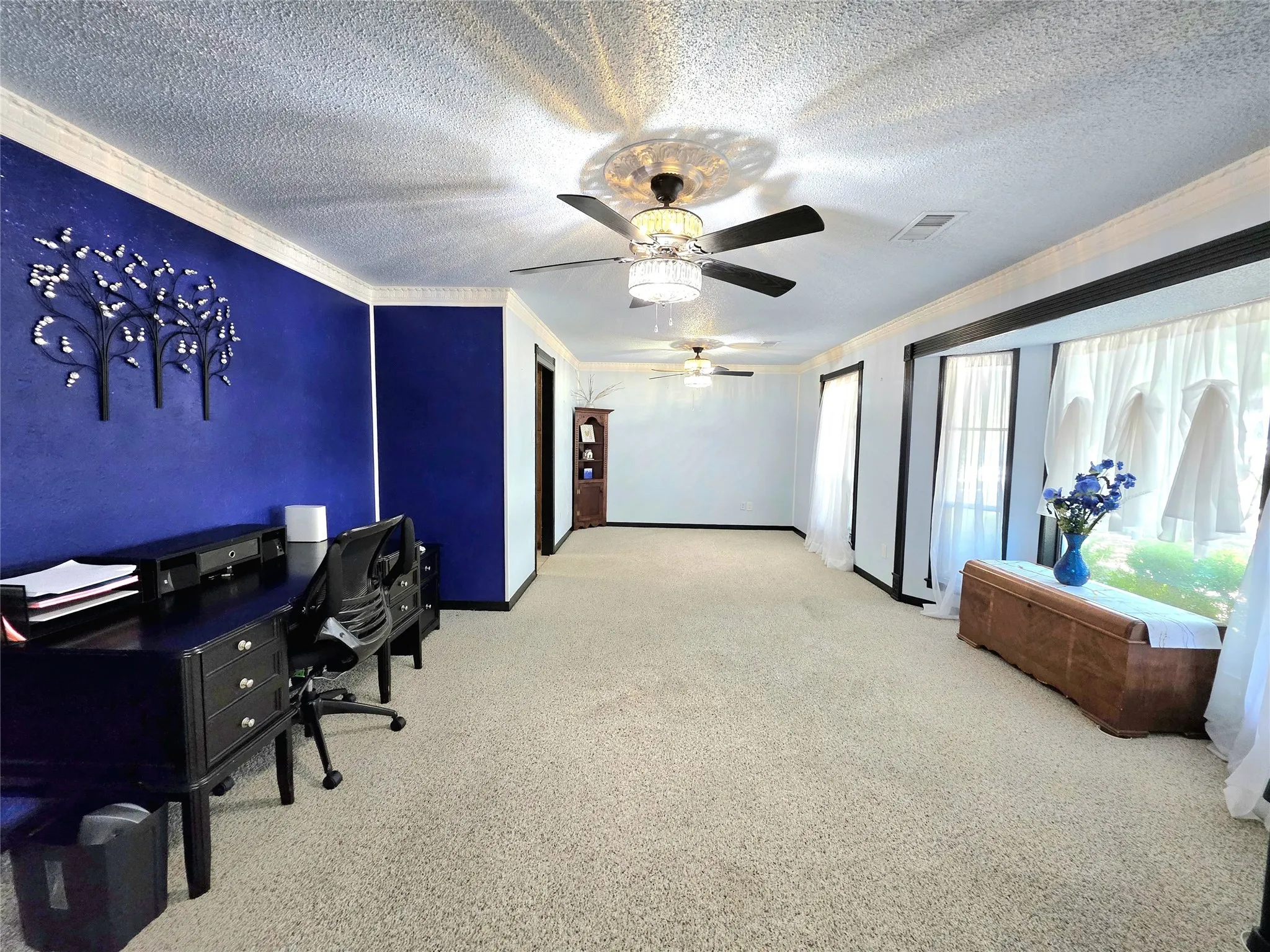 Living and dining combination space offers flexibility for use as an office or game room, etc.