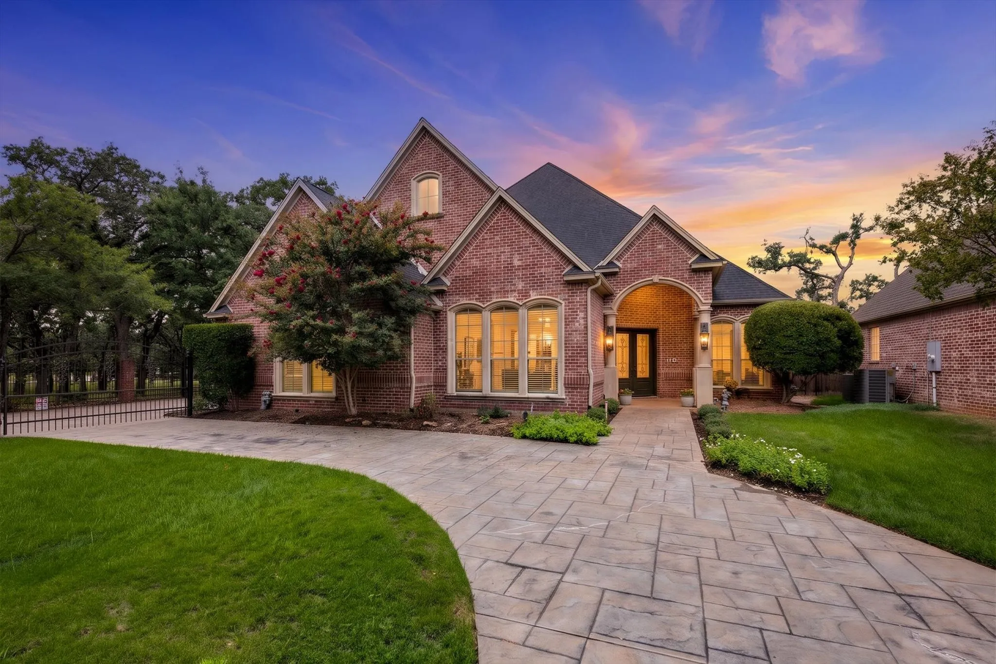 Welcome Home!  Beautiful drive up appeal with extra parking and an automatic gate for privacy.