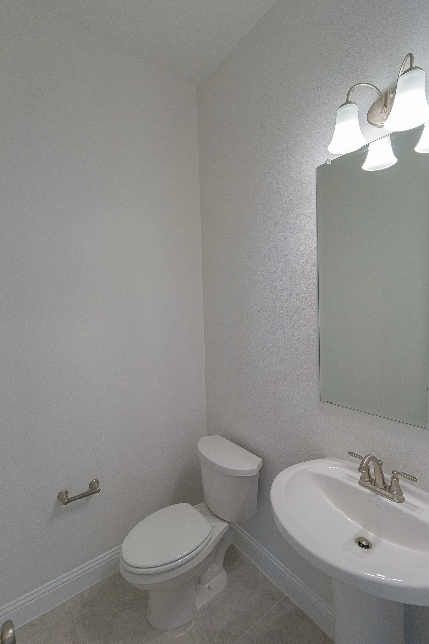 Half bath featuring tile patterned floors