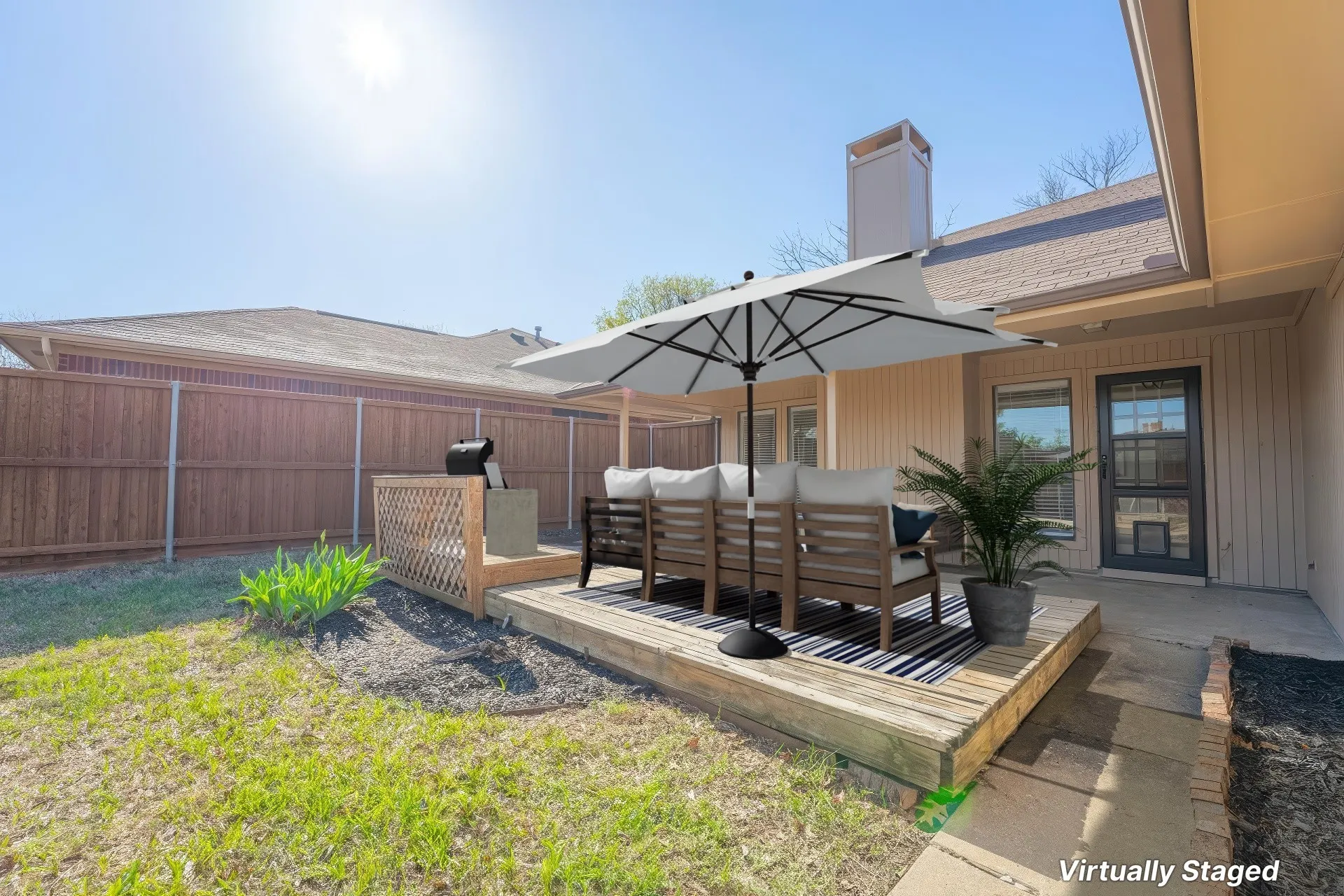 Wooden deck with lattice accent, surrounded by a wood-paneled fence