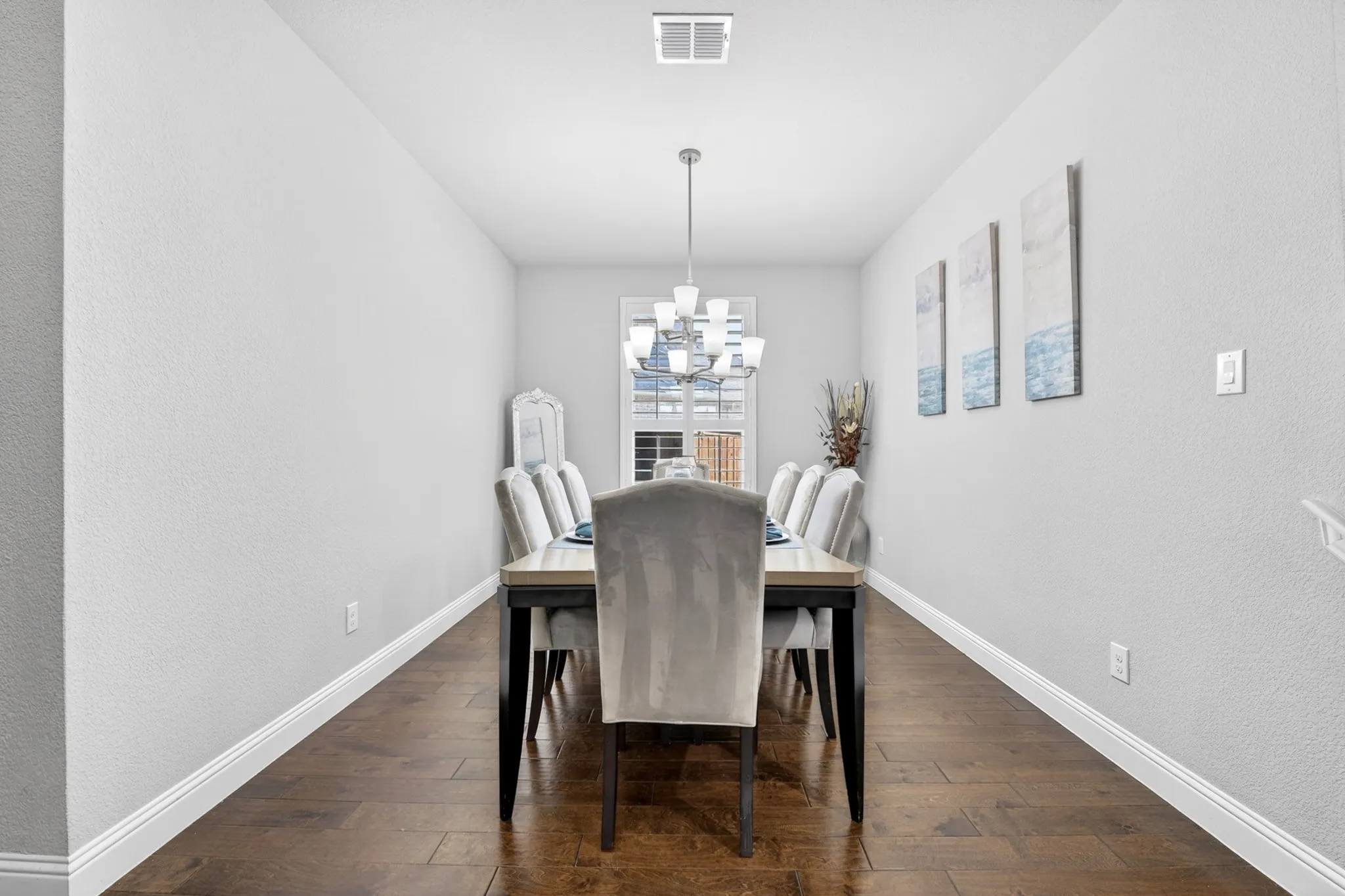 Wood-finish flooring with crisp white baseboards