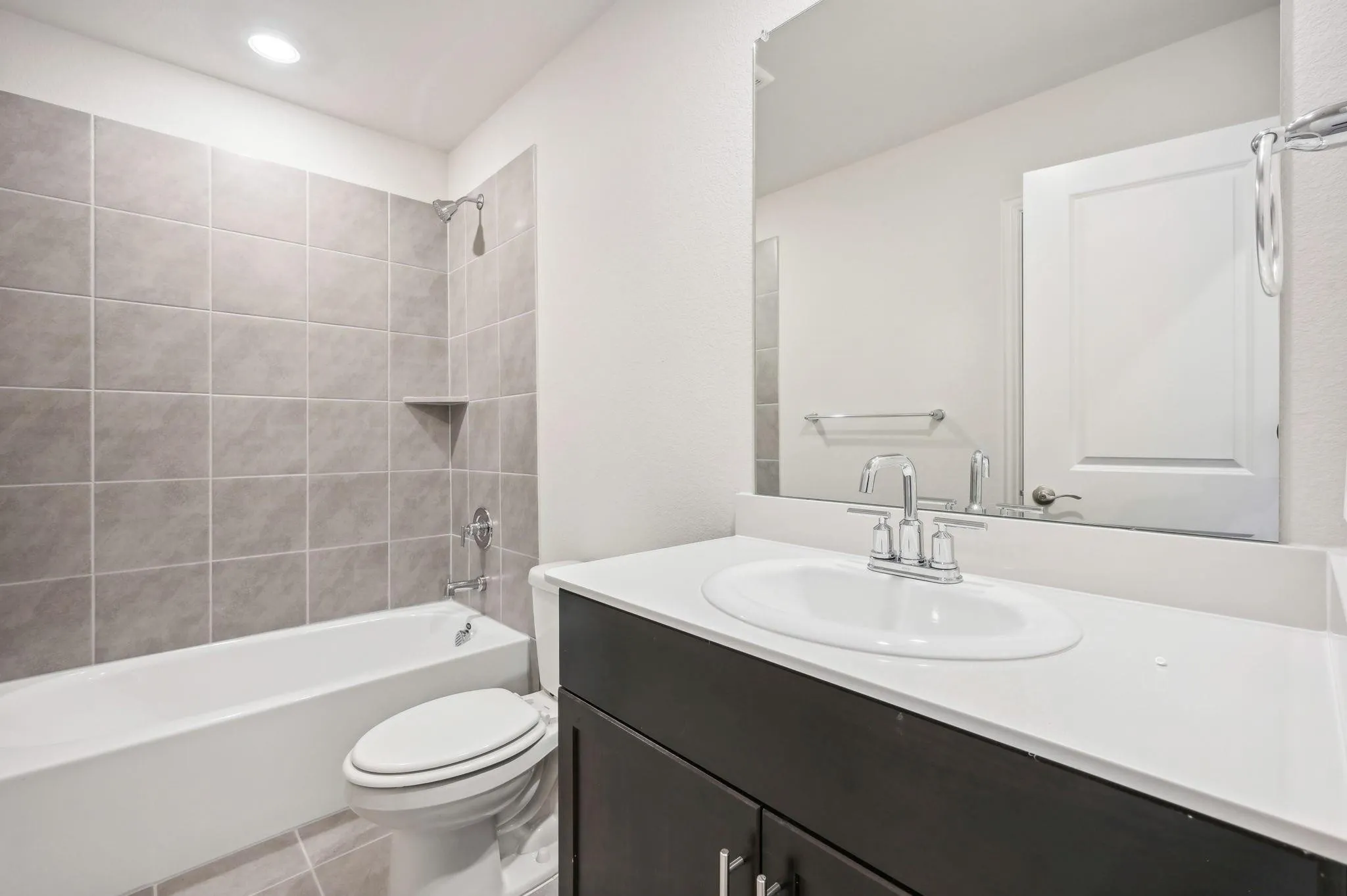 Full bath featuring tile patterned flooring, vanity, toilet, recessed lighting, and shower / bathing tub combination