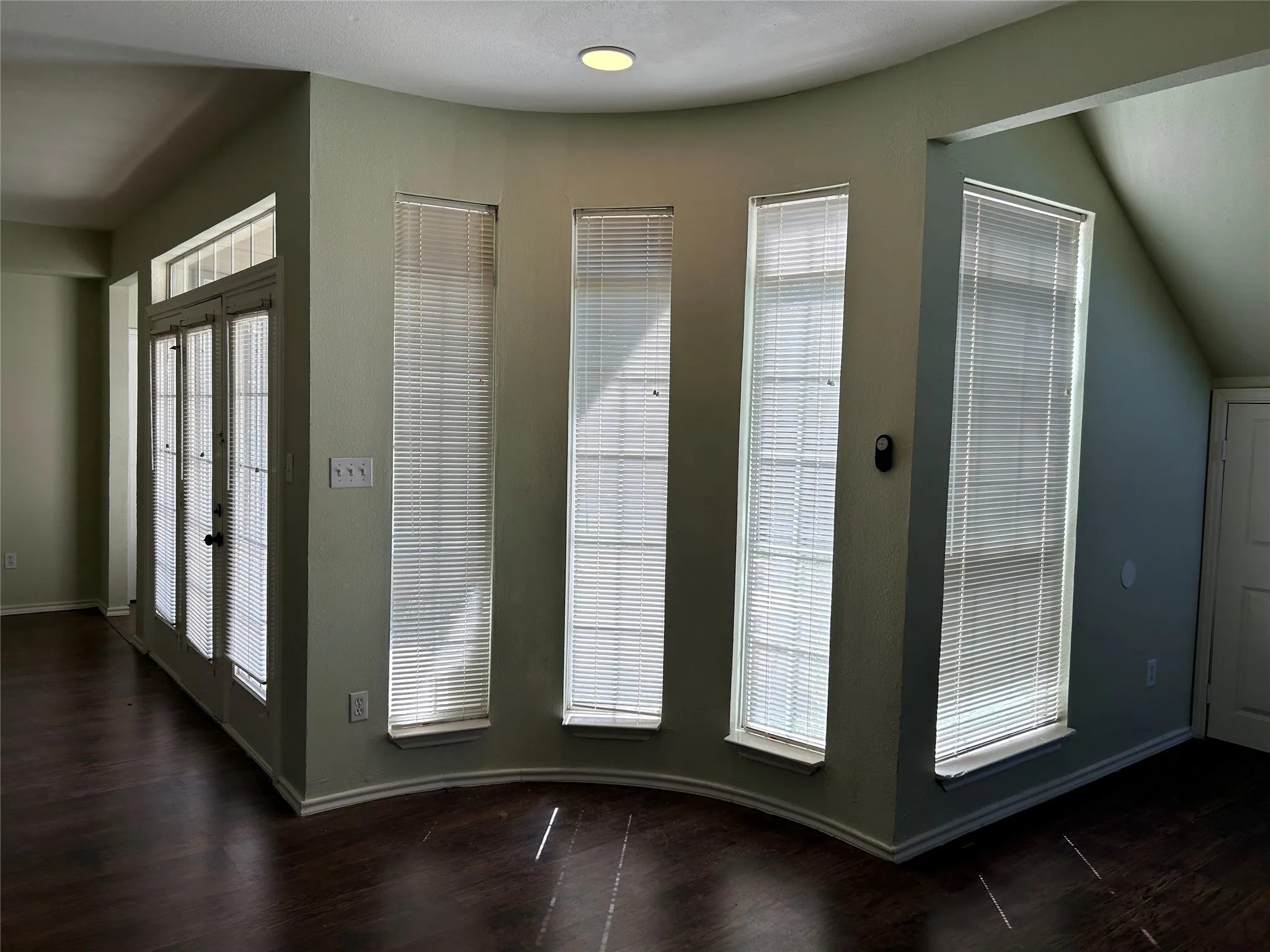 Bay windows opposite of the dining area.