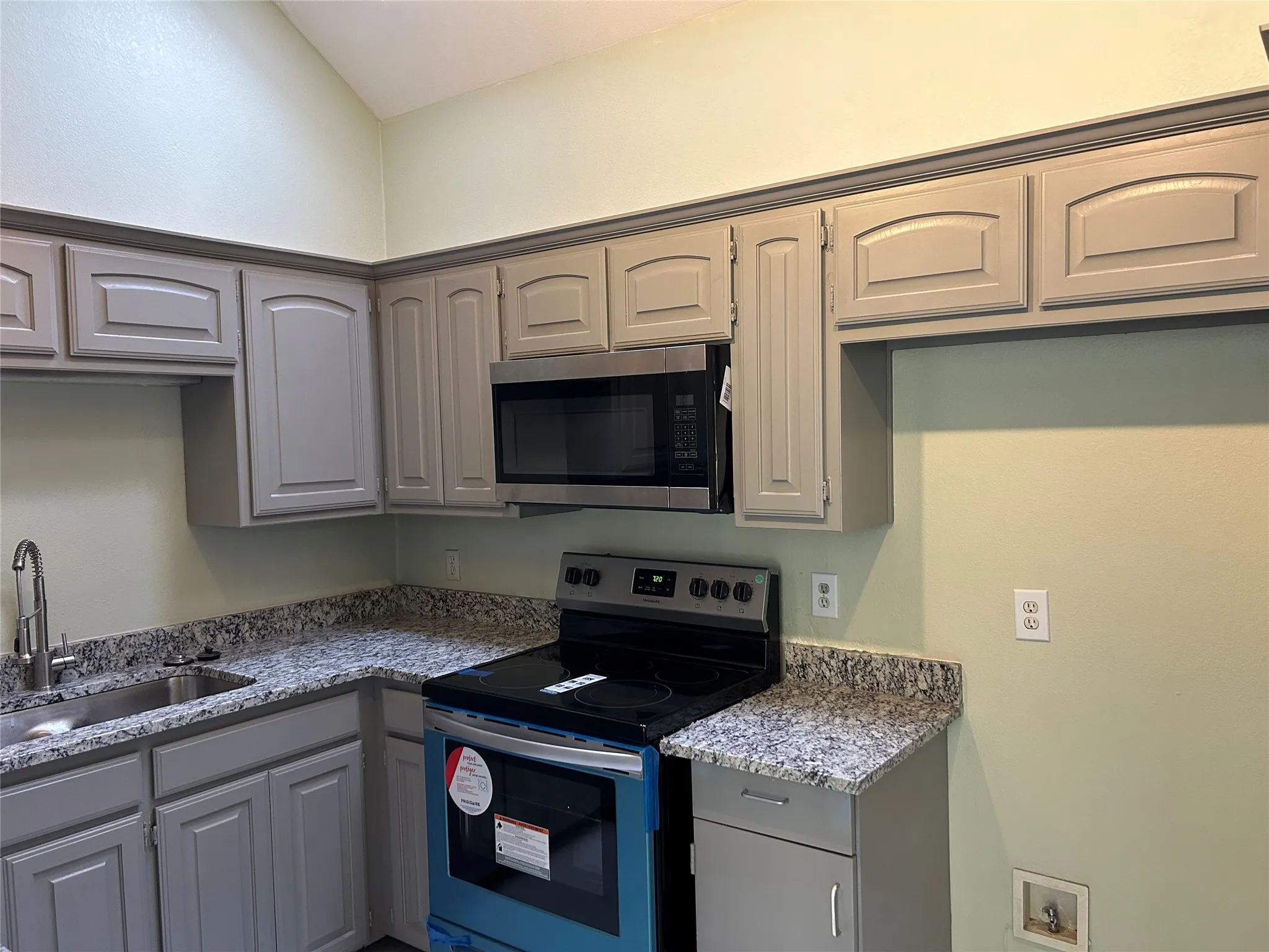 Kitchen with granite countertops.
