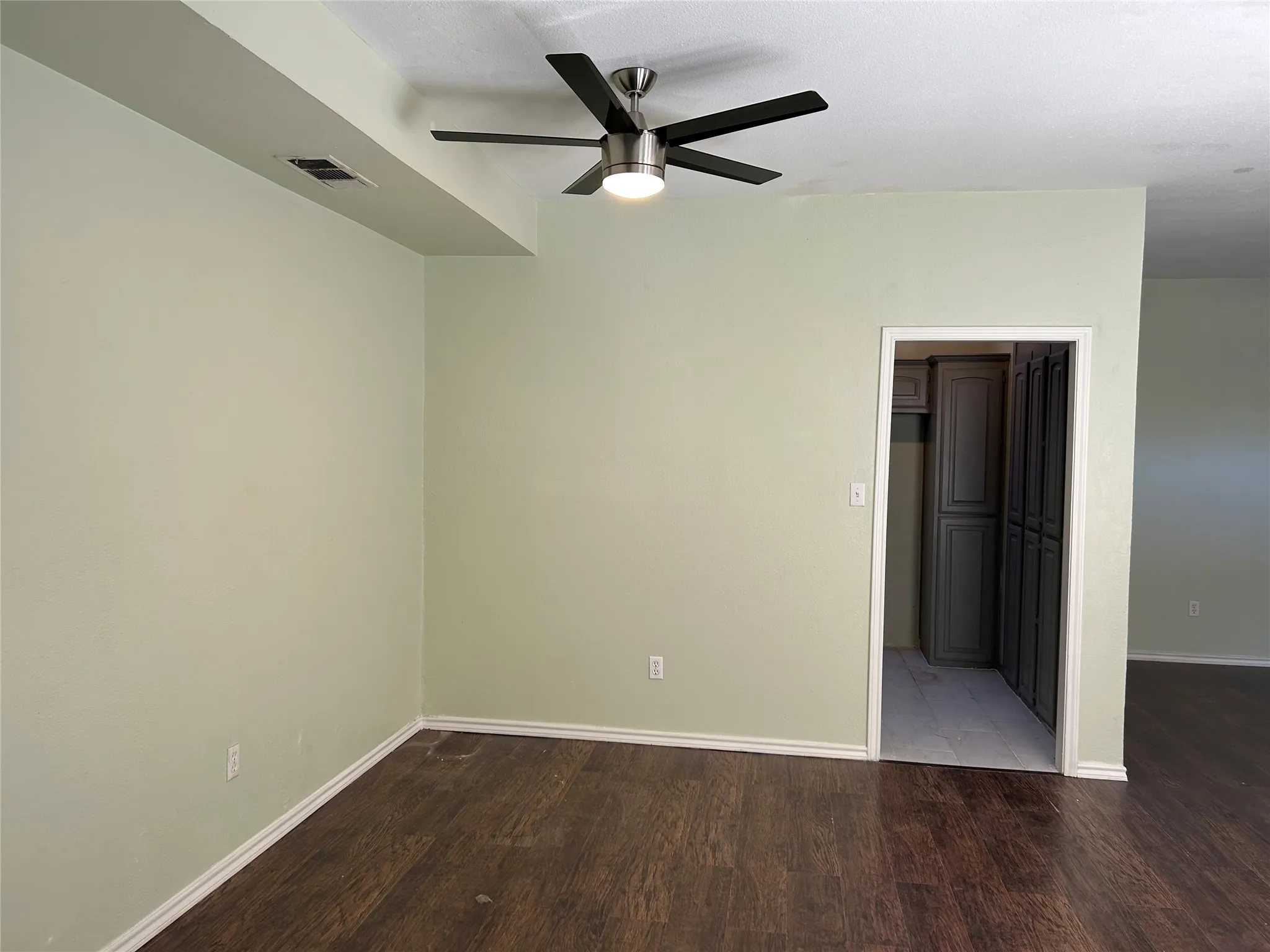 Dining area with doorway to kitchen.