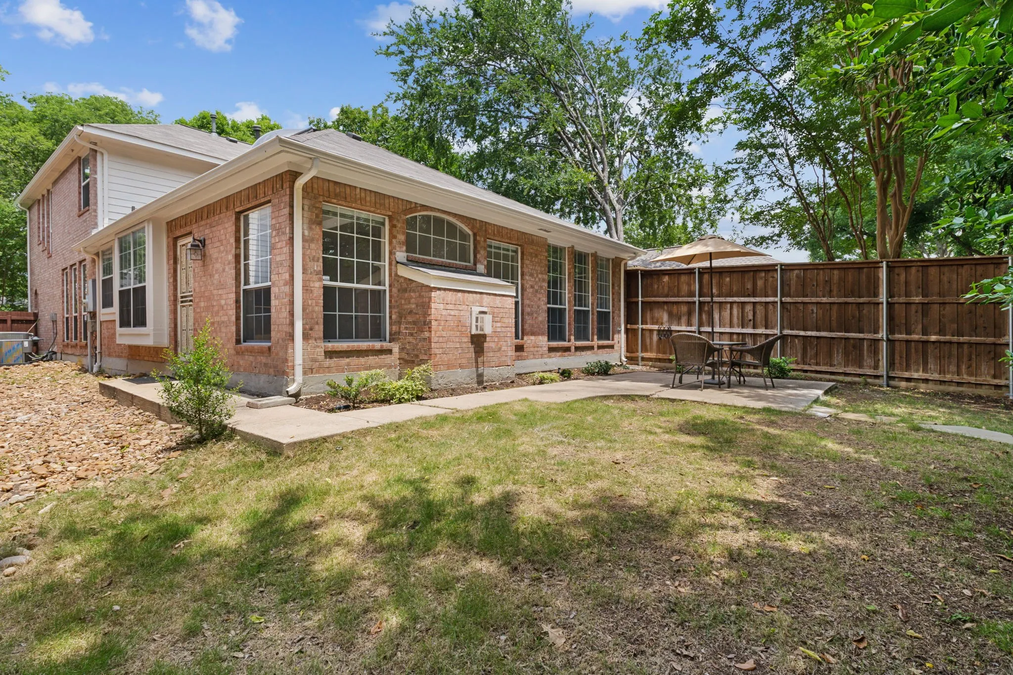 Expansive brick exterior with multiple windows