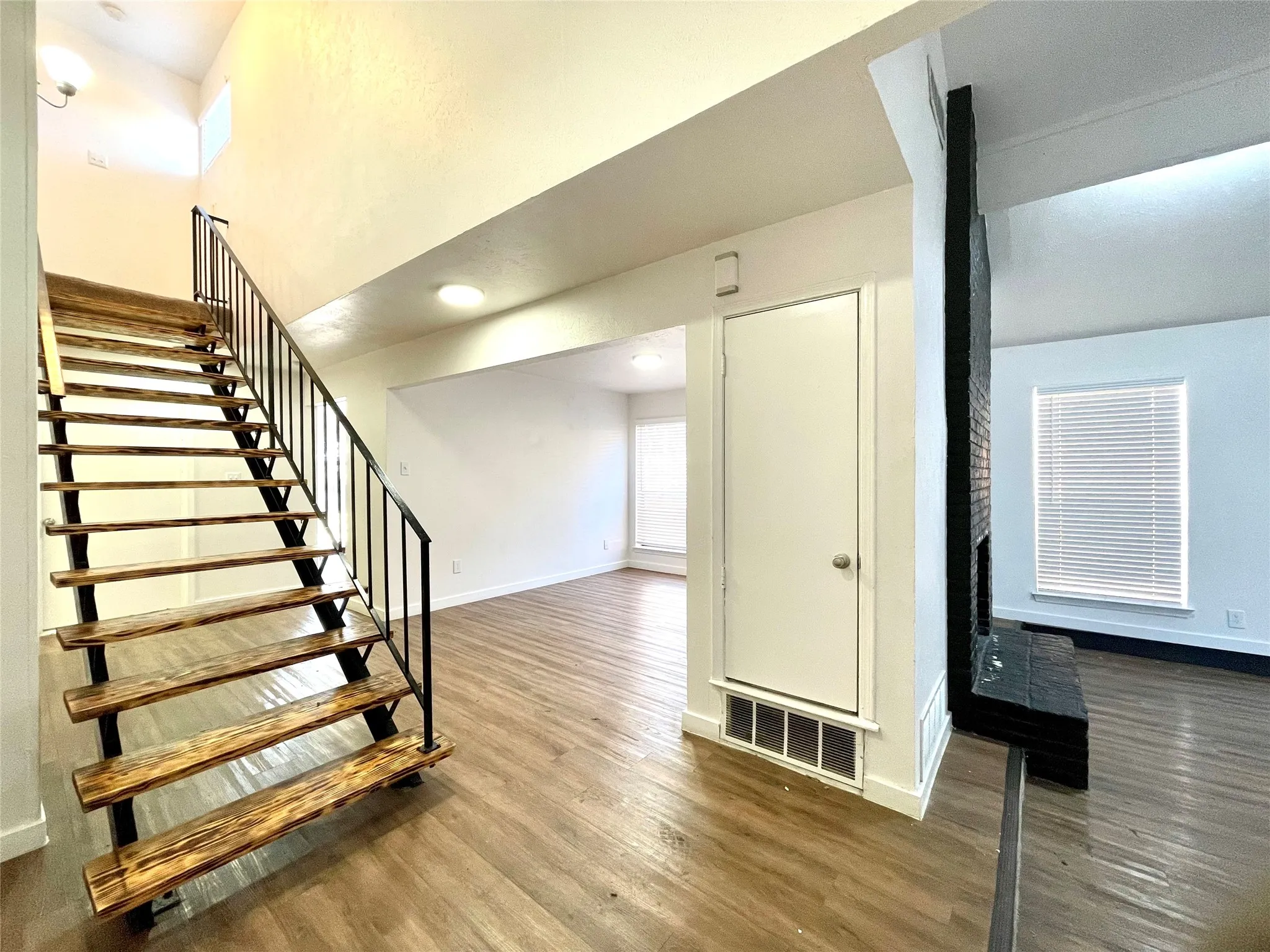 Stairway with hardwood / wood-style flooring