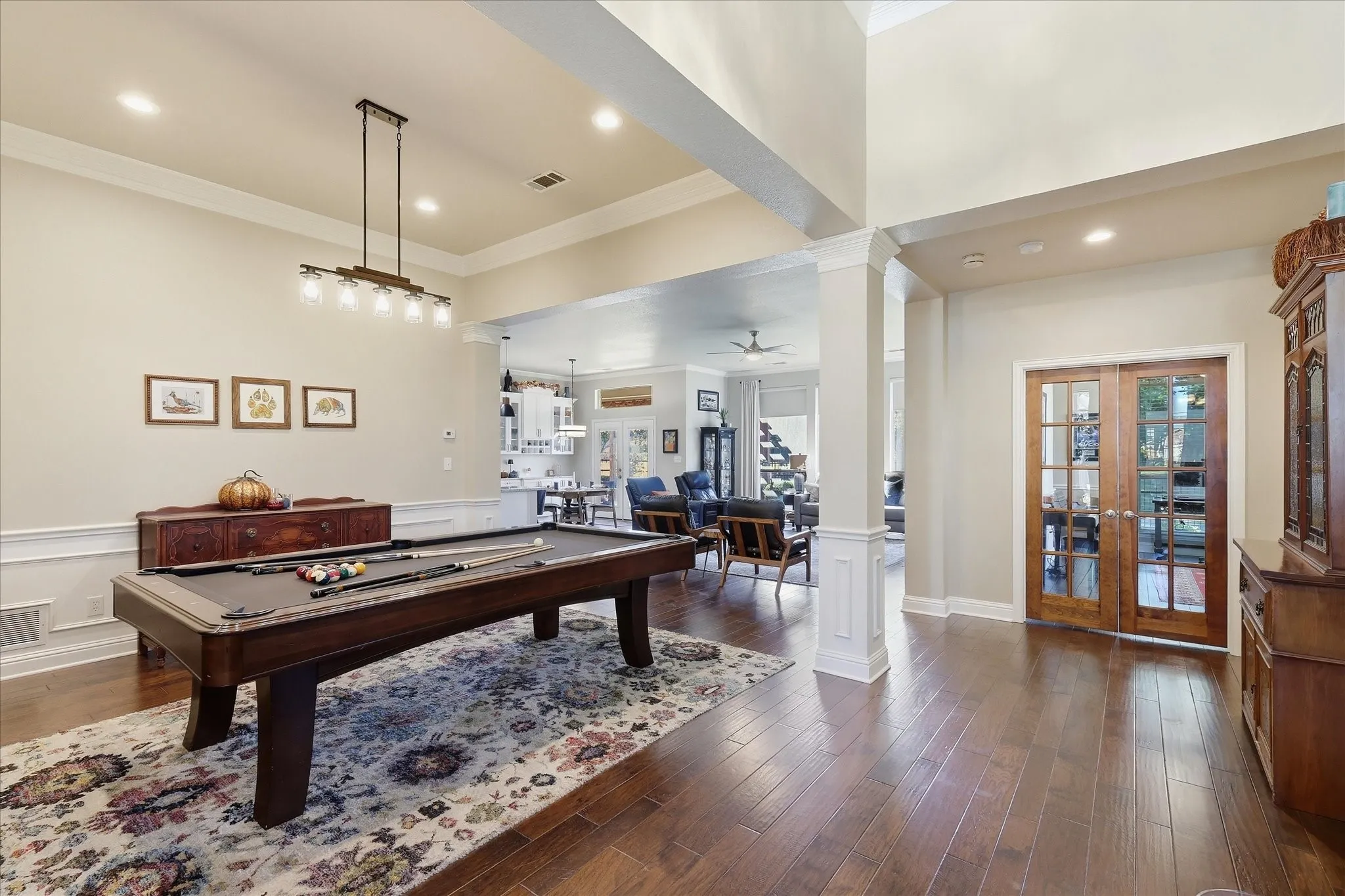 View upon entering. Formal Dining is being used as a pool table room. Dedicated Office with DBL French doors.