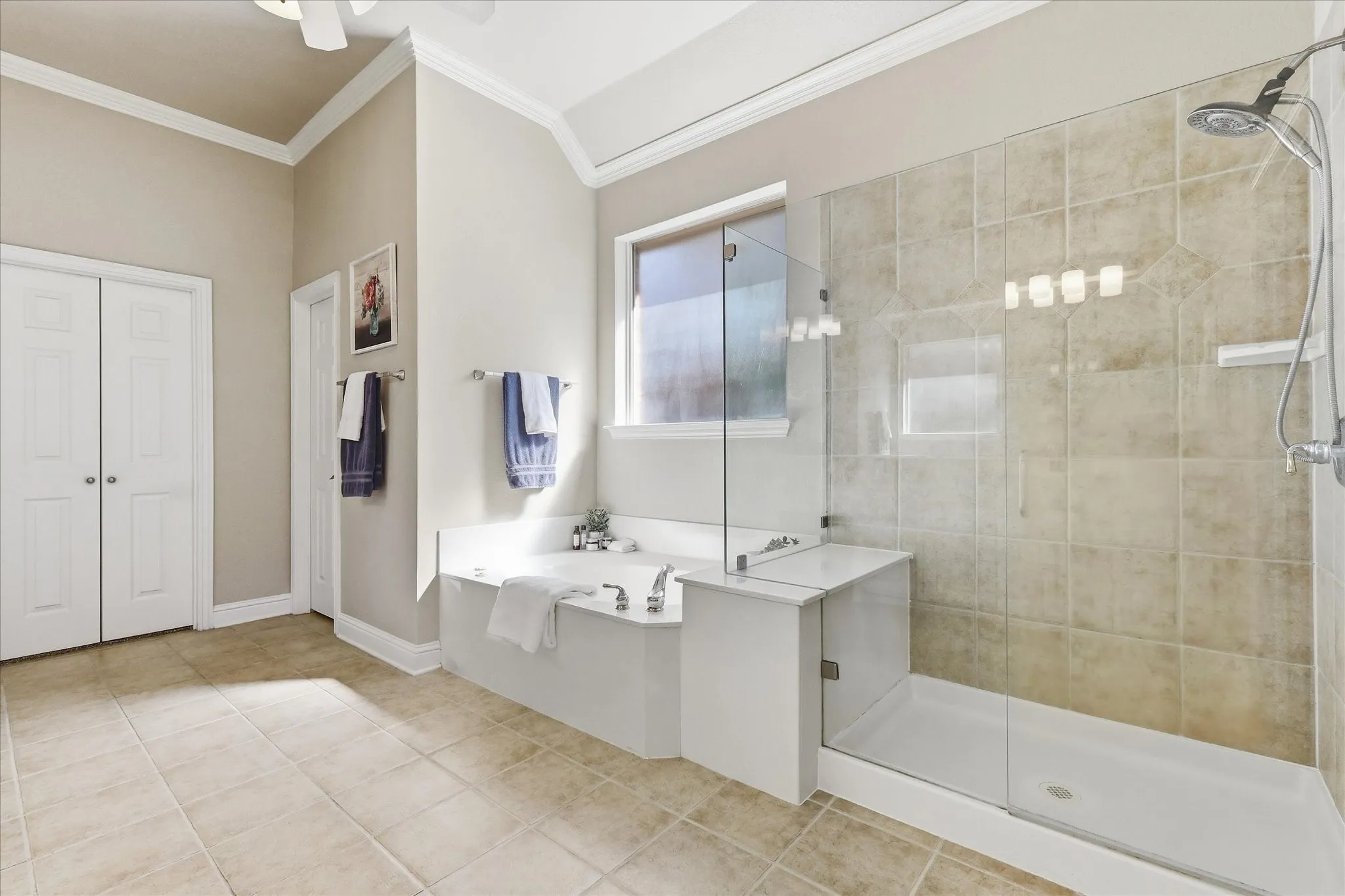 Main bath has dual vanites, jetted garden tub, large walk-in shower & huge closet that opens into the Ut RM.
