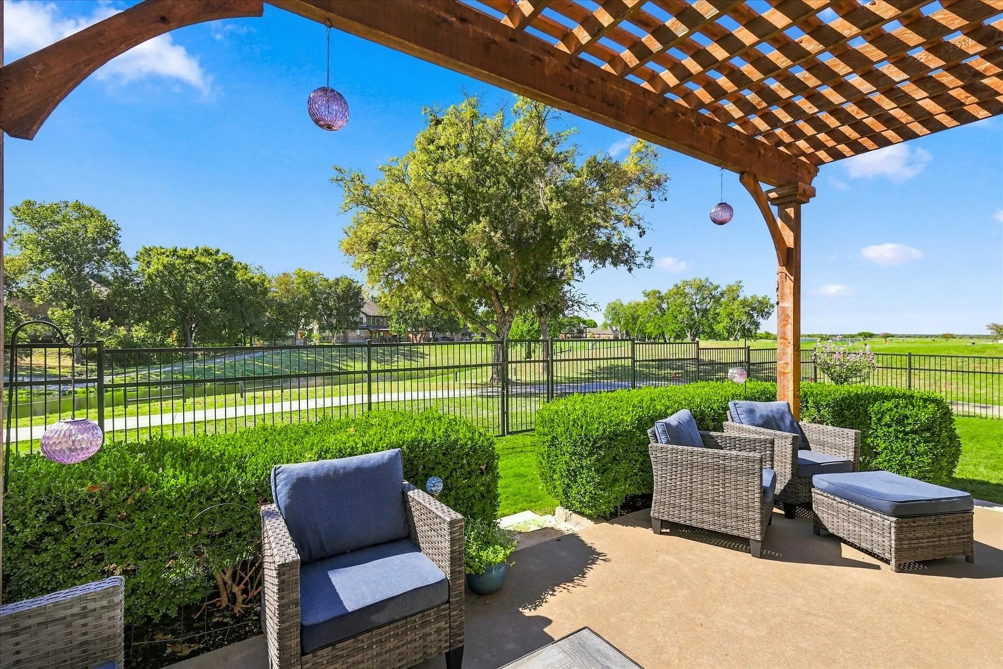 Large patio with pergola and breathtaking views of the golf course, lake & sunsets all year round.
