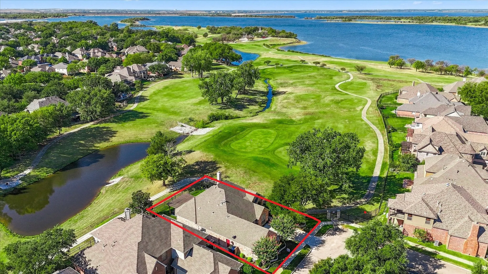 This corner lot on the 6th green has trail access & sunset views over the lake all year round.