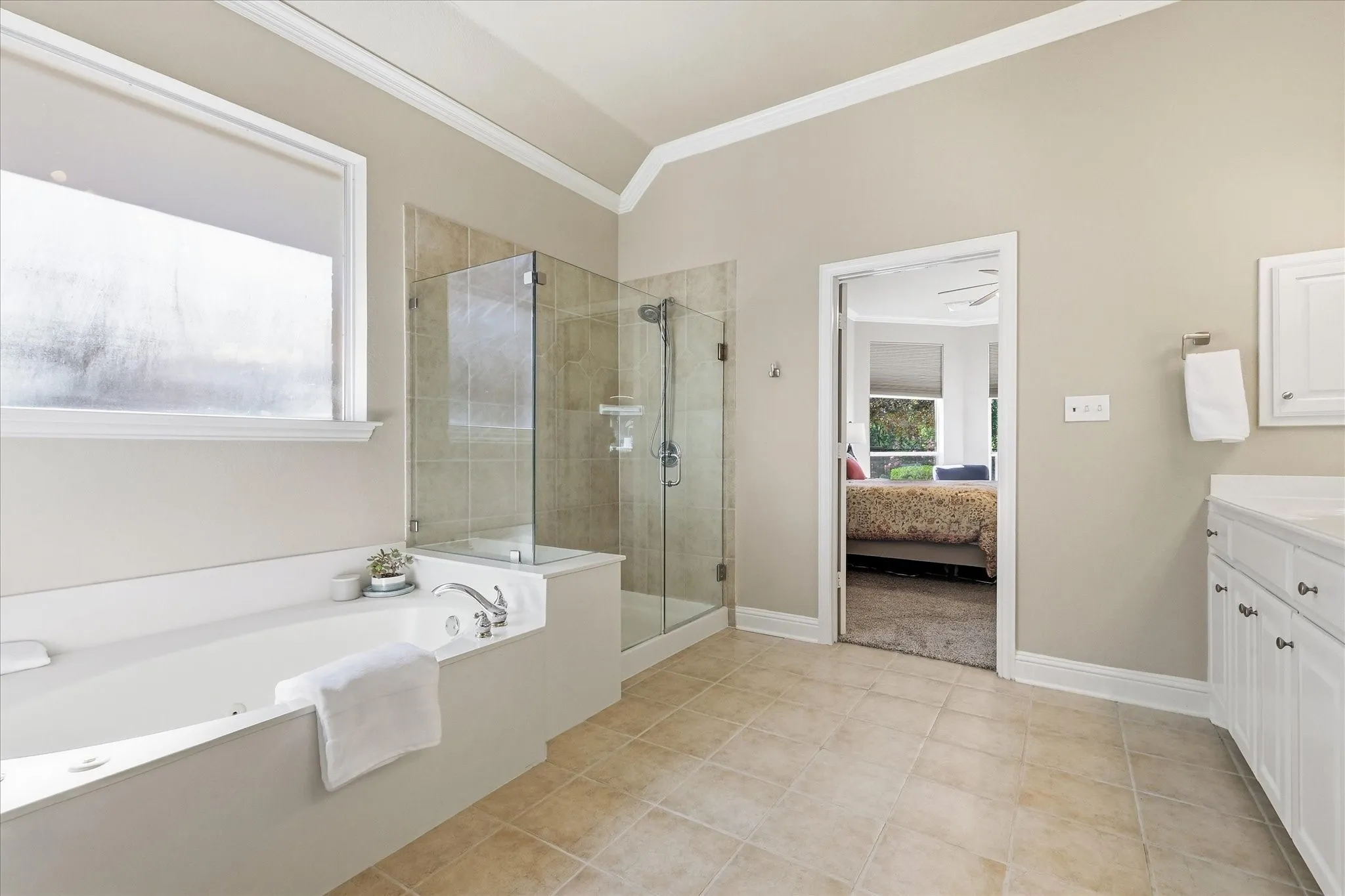Main bath has dual vanites, jetted garden tub, large walk-in shower & huge closet that opens into the Ut RM.