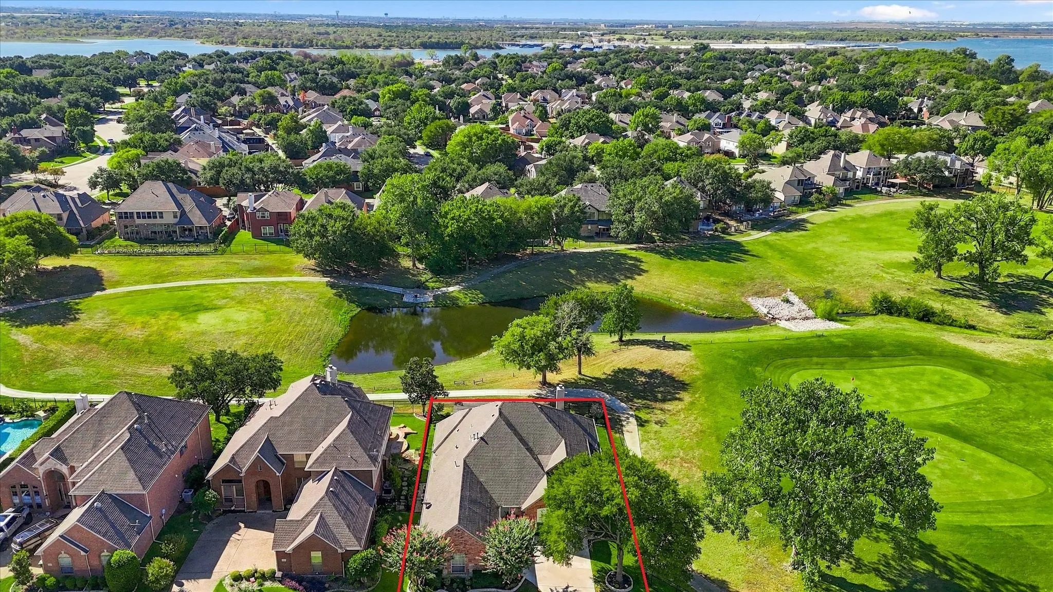 This corner lot on the 6th green has trail access & sunset views over the lake all year round.