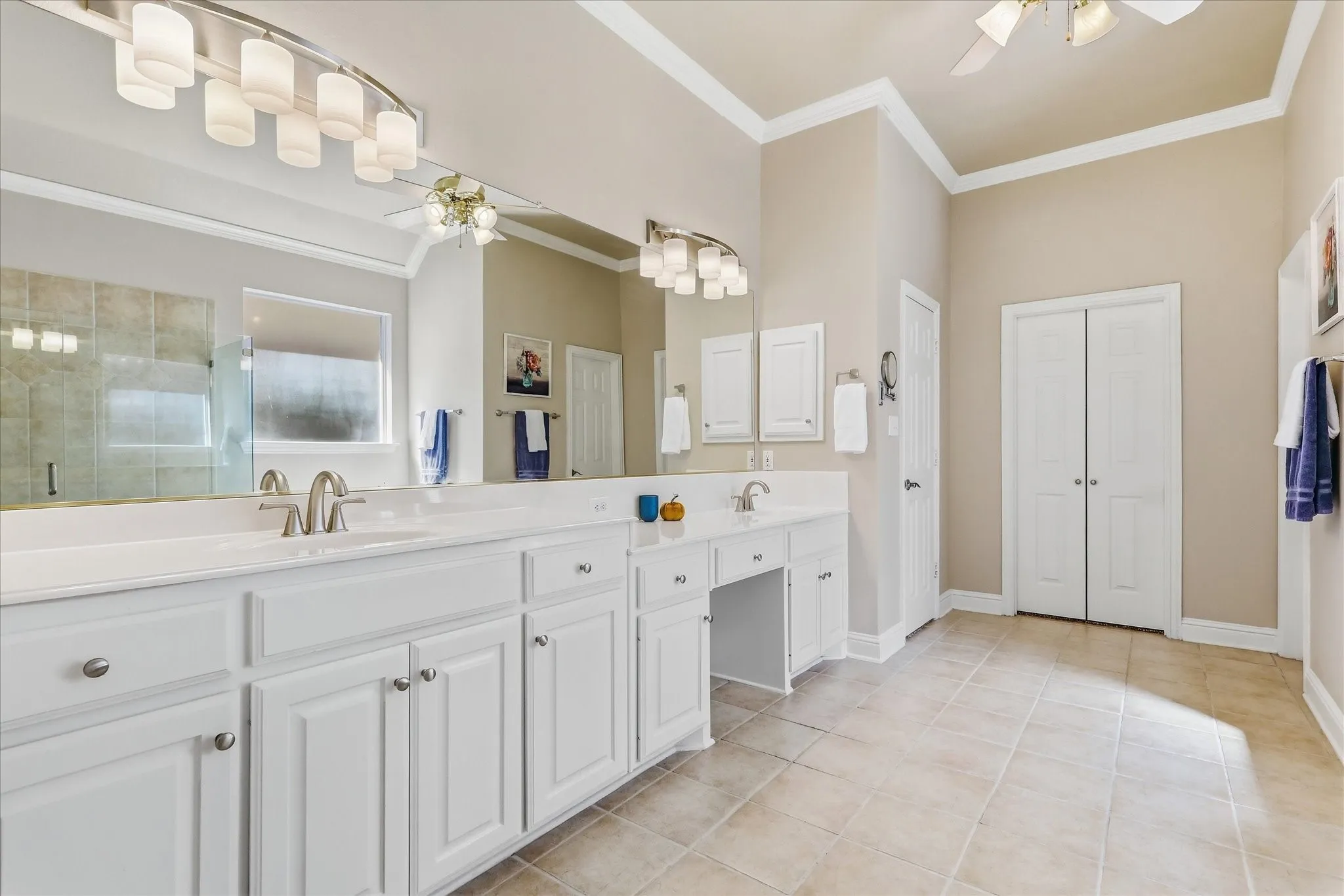 Main bath has dual vanites, jetted garden tub, large walk-in shower & huge closet that opens into the Ut RM.