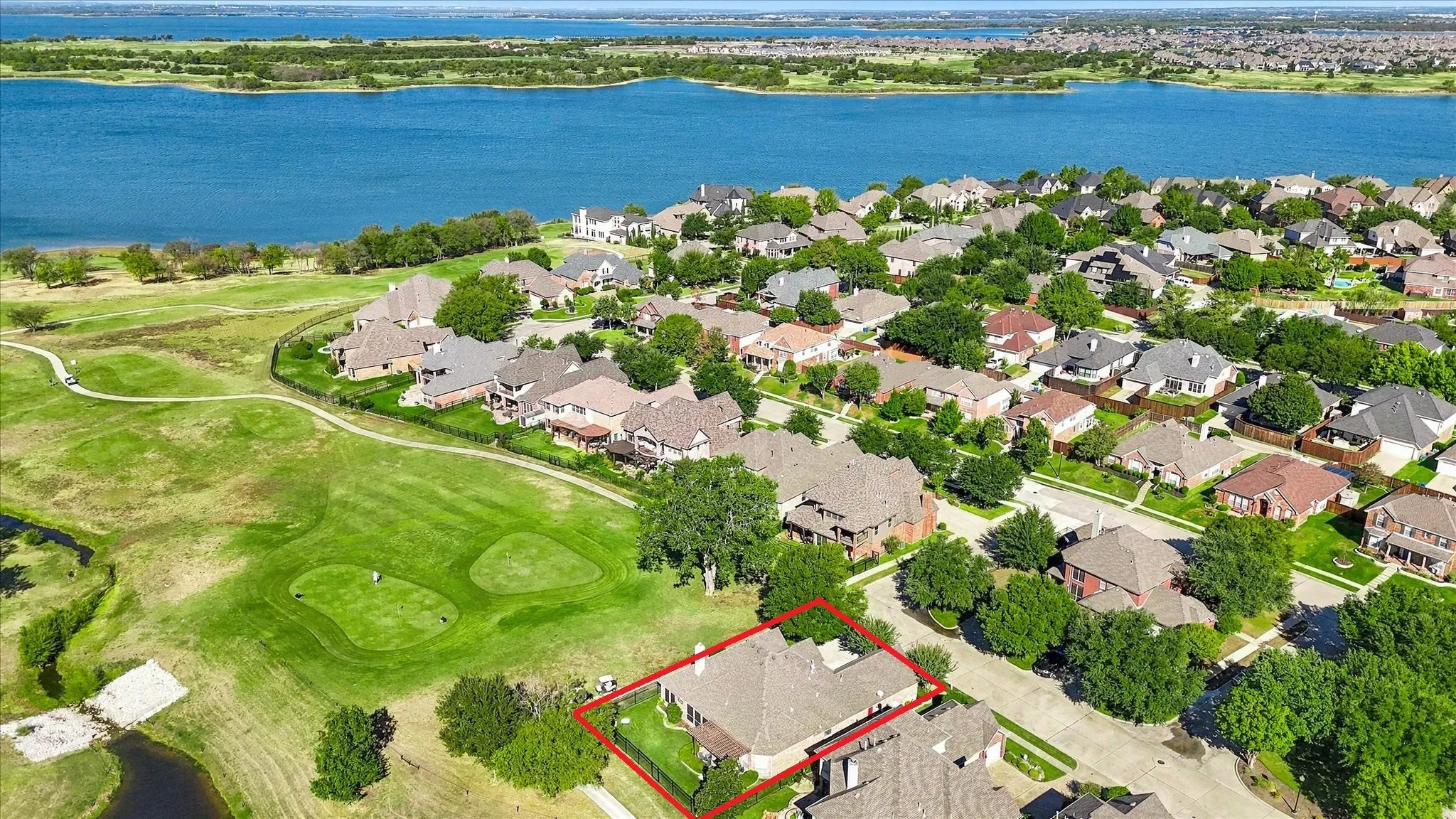 This corner lot on the 6th green has trail access & sunset views over the lake all year round.