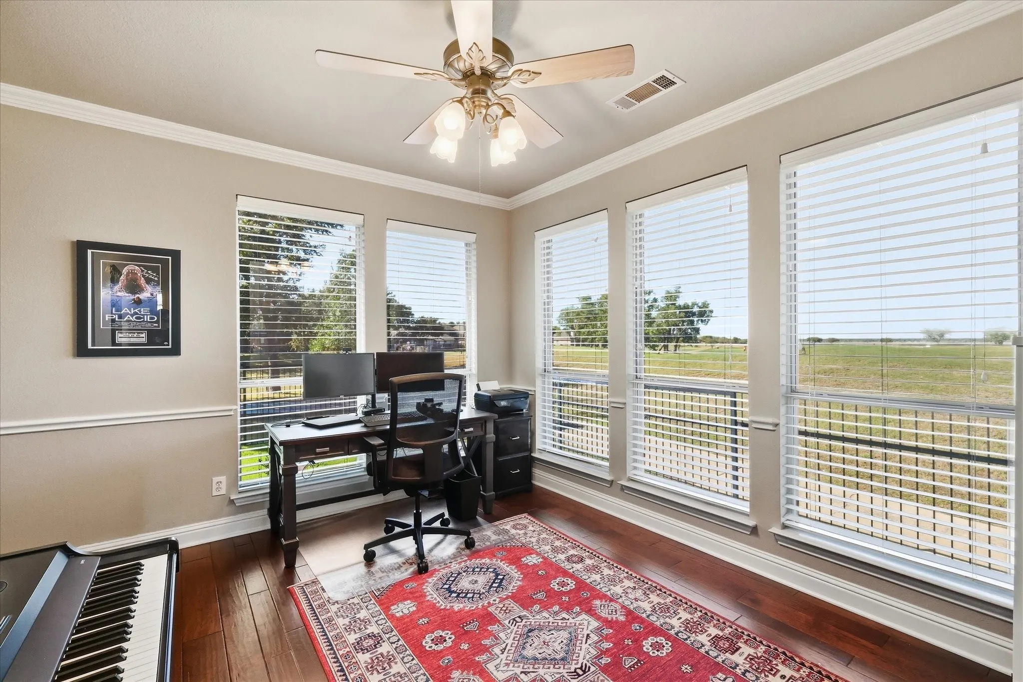 Dedicated office has DBL French doors & views of the lake & golf course.