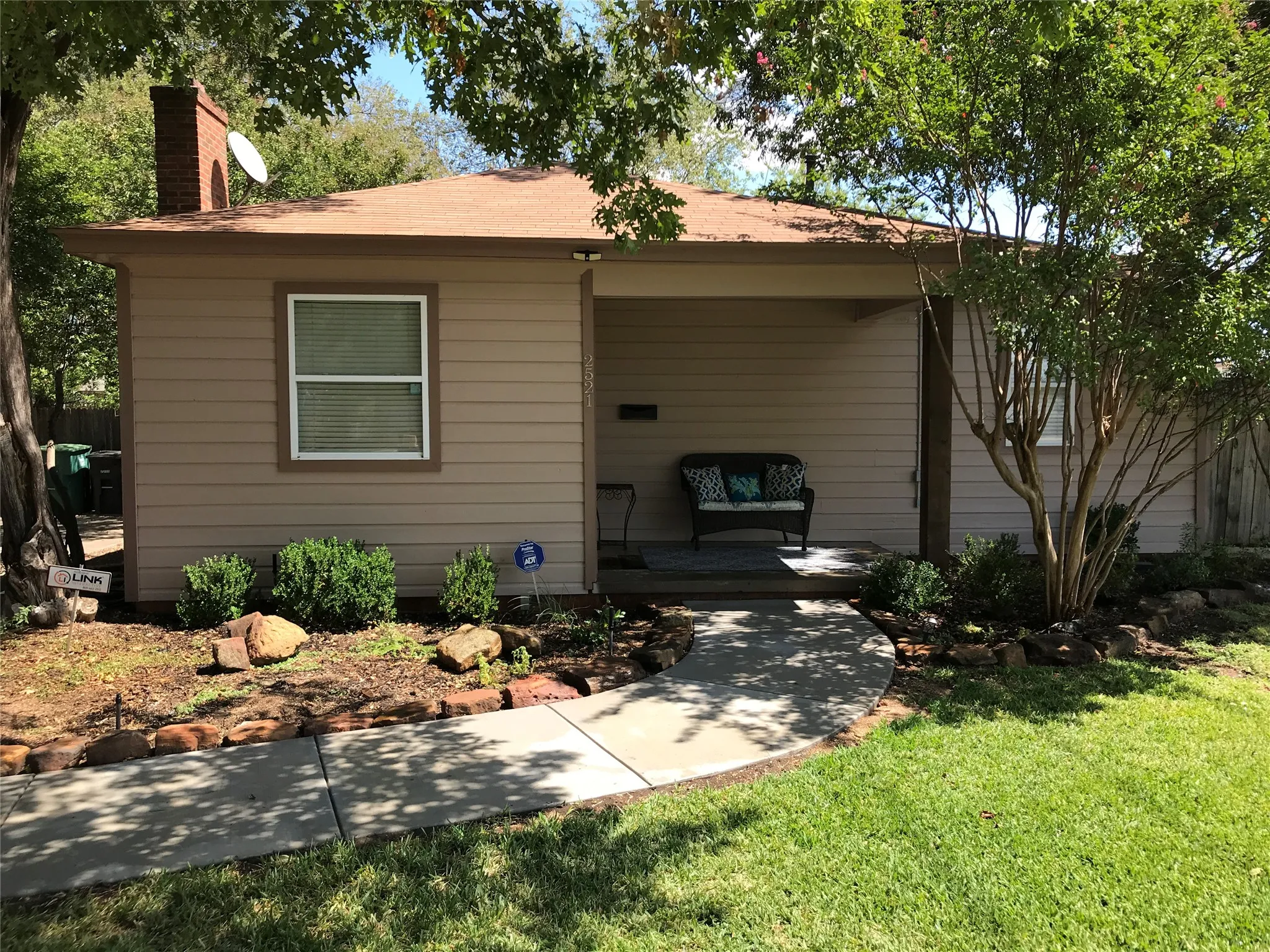 Siding exterior with a covered porch