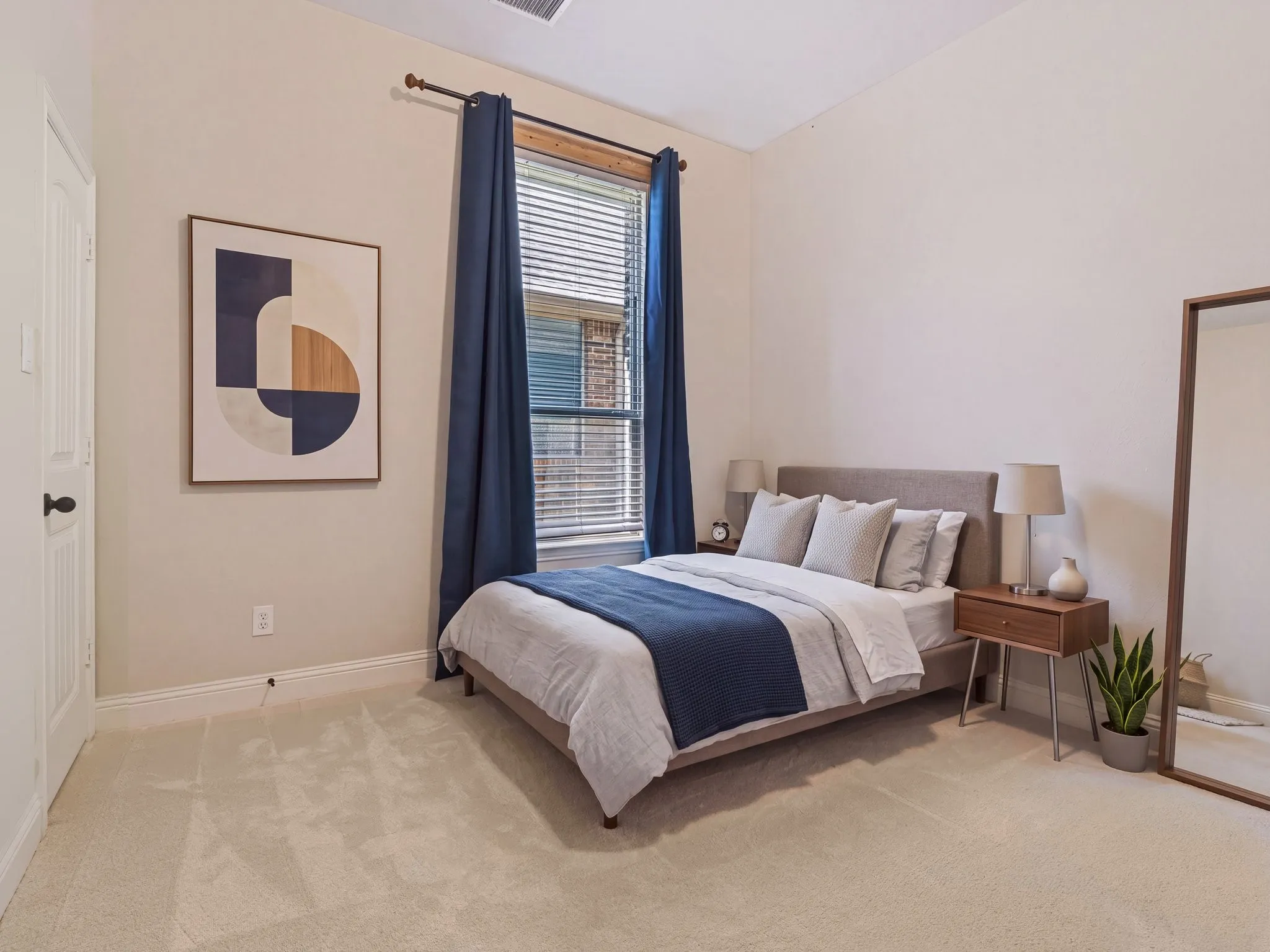 Plush carpet flooring, neutral painted walls, window with blinds, recessed lighting, and a solid-core door