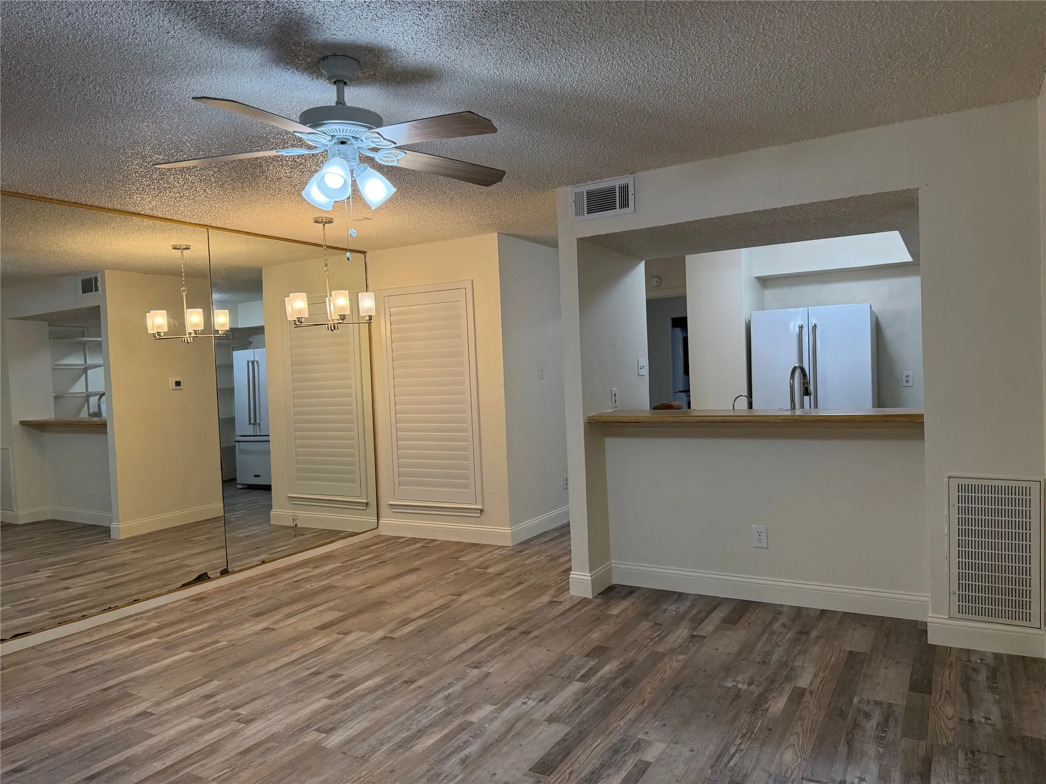 Living Room and Dining Area opens to Kitchen with bar top seating
