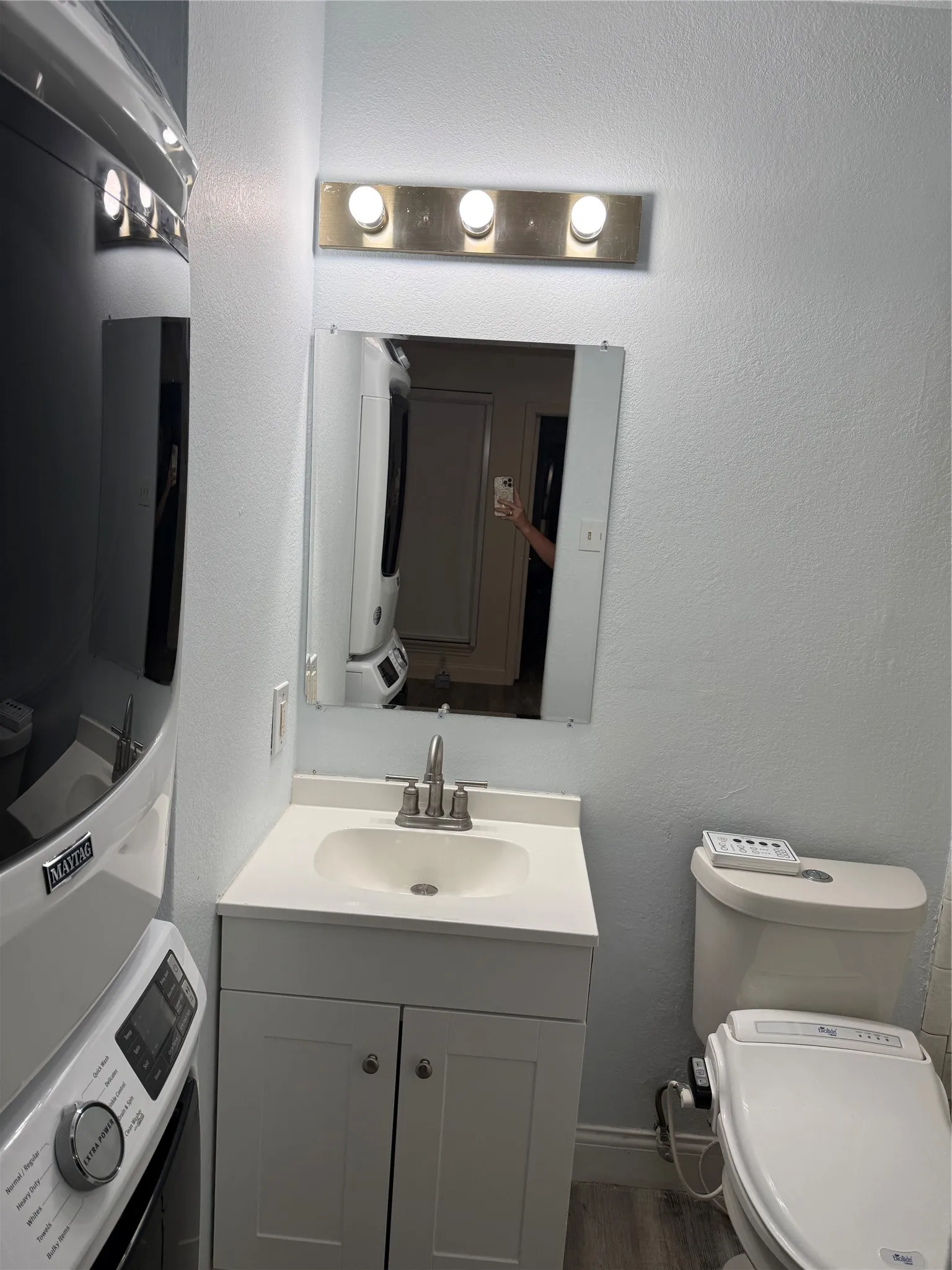 Bathroom with tub shower and vanity.