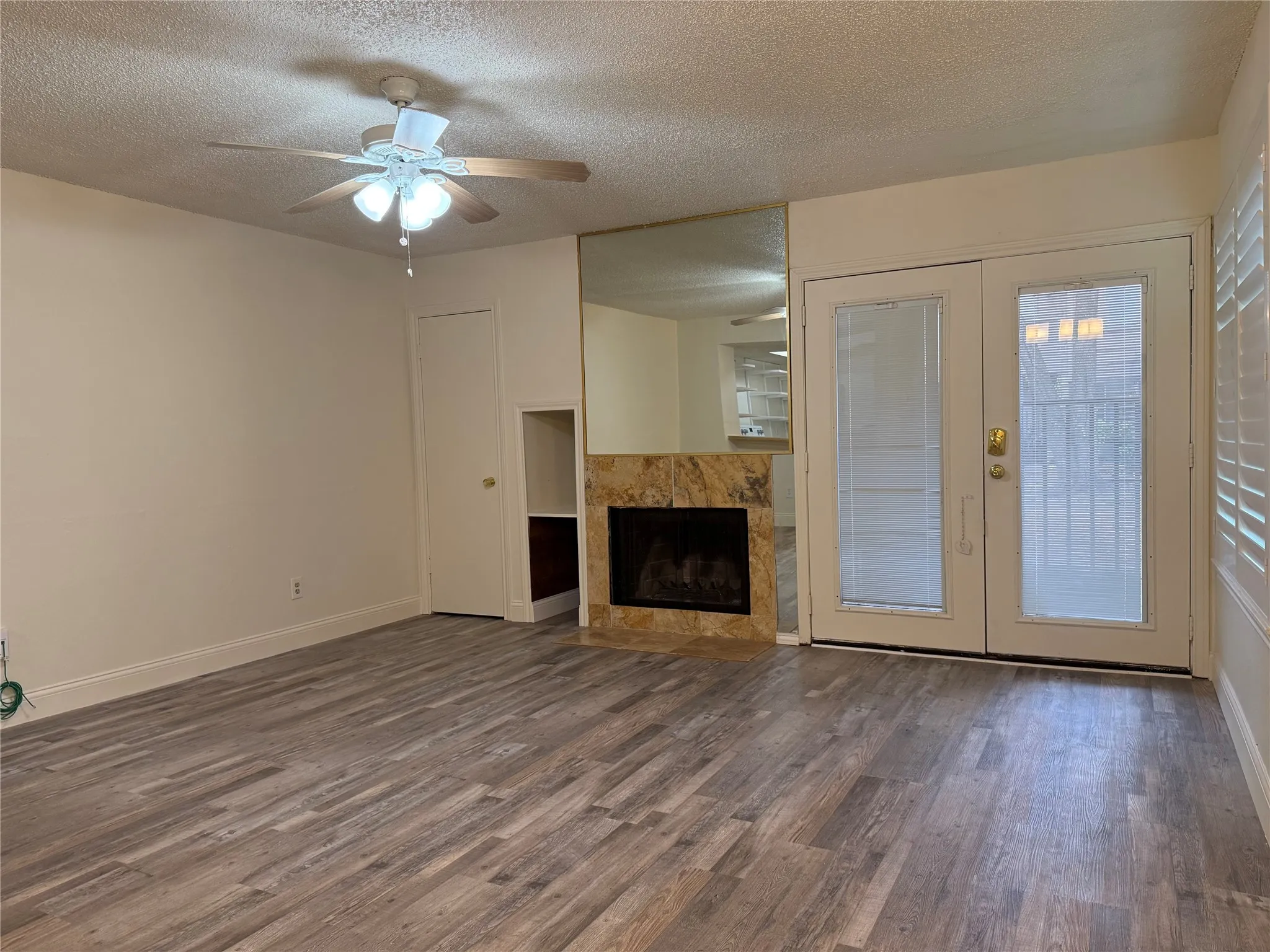 Entrance to Living Room with wood burning Fireplace and closet