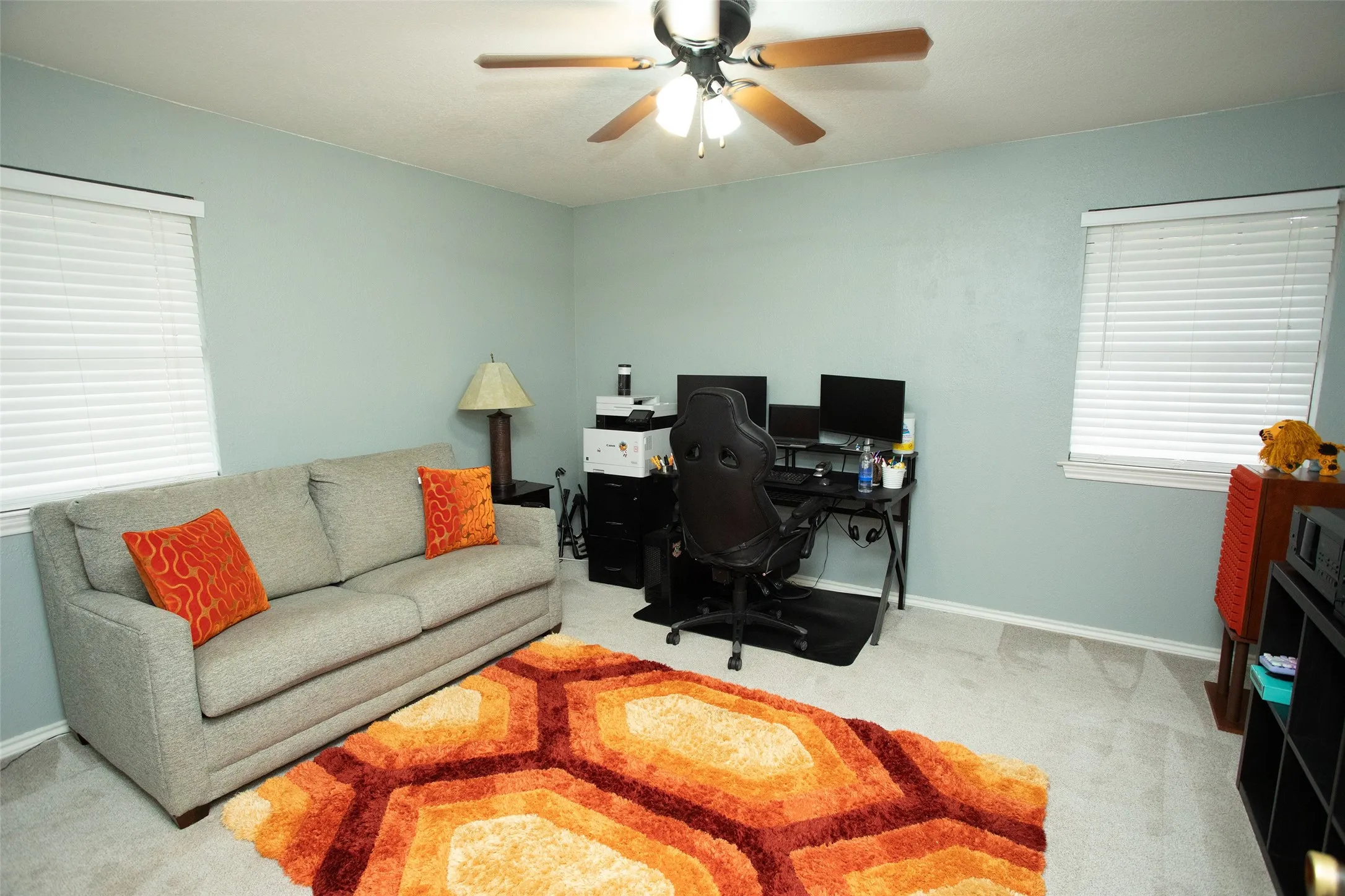 Recessed lighting, ceiling fan, two windows, wall-to-wall carpeting, and light-colored walls