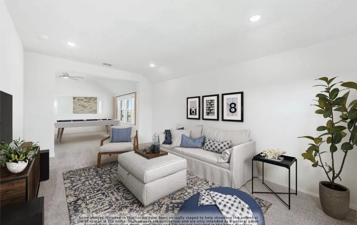 Carpeted living room featuring recessed lighting, a ceiling fan, and lofted ceiling