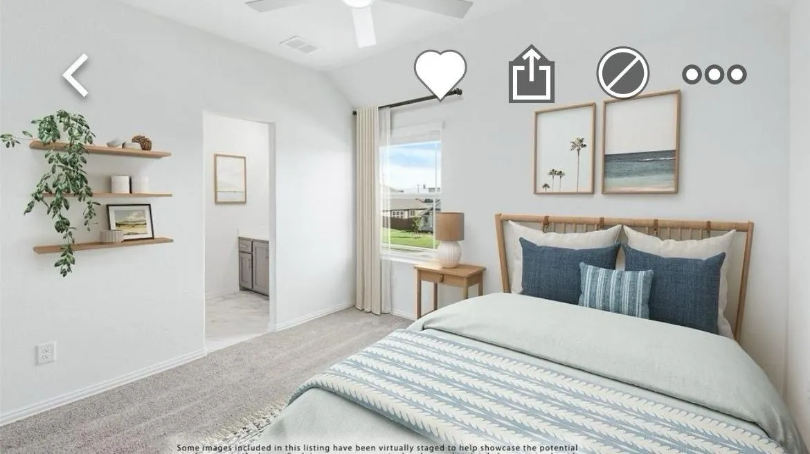 Carpeted bedroom with ensuite bathroom and lofted ceiling